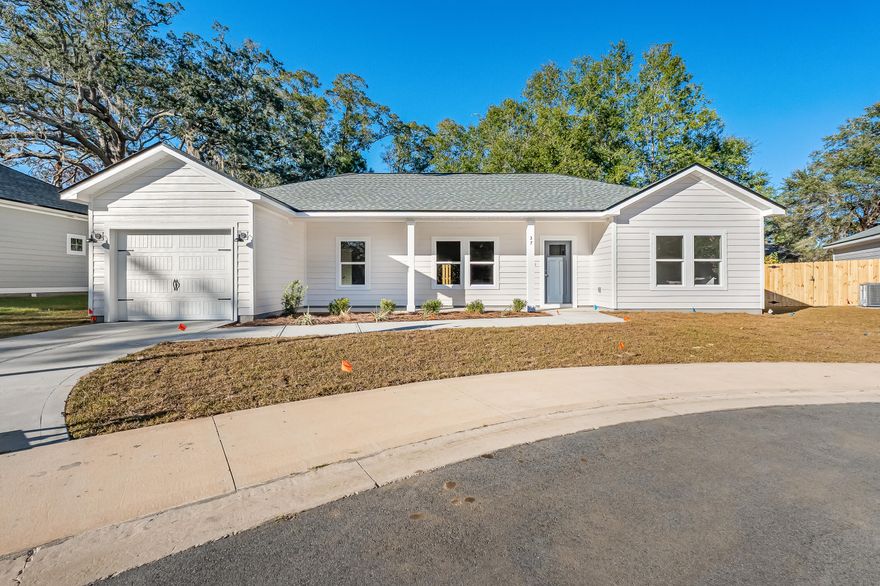 PRICE REDUCED - SELLER WILL CONTRIBUTE UP TO $15,000 TOWARDS CLOSING COSTS/PREPAIDS/RATE BUYDOWN - COZY COTTAGE HAS CAREFULLY DESIGNED FLOOR PLAN maximizing your living space.  Covered front porch, finished garage and fully landscaped yard comes with yearly grass cutting (HOA includes 40 cuts per year).  Split BR design, raised ceilings in open family/dining/kitchen area.  Luxury vinyl plank flooring throughout, quartz countertops, work island w/bar seating, white shaker cabinets + pantry in kitchen.  Primary bedroom has double walk-in closets, bath has double vanities + linen storage.  Oversized mud room has room for washer/dryer + freezer or lockers/benches.  Ceiling fans in all bedrooms & family room, recessed lighting throughout the home. READY NOW