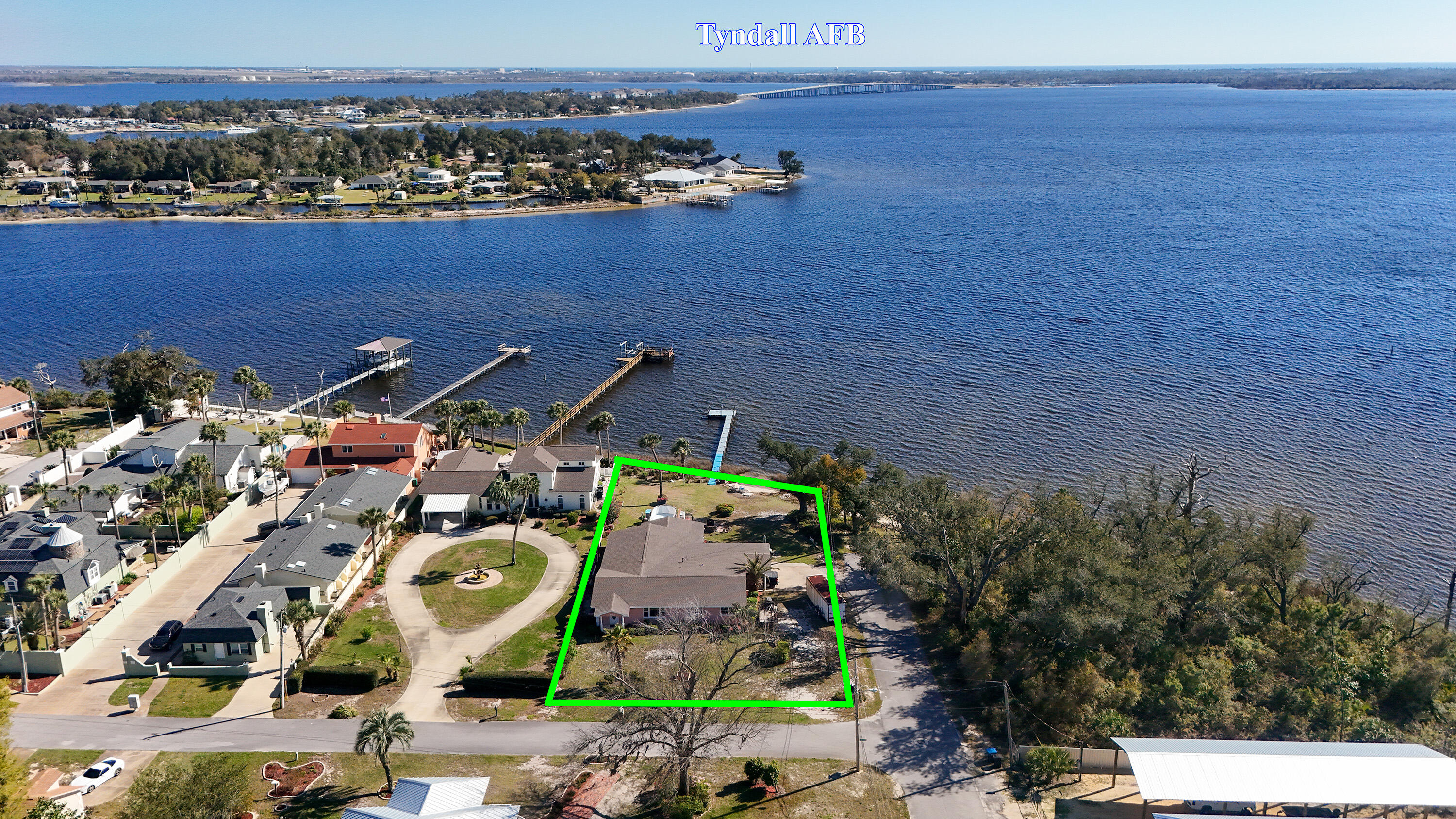 Owner relocating. MOTIVATED SELLER. Furniture negotiable. Introducing 4700 6th St E, a renovated waterfront enclave sitting on a 0.40-acre point lot with over 90 feet of frontage and wide open water views of the intercoastal waterway. This 3-bedroom, 2-bathroom home in Panama City features 2,550 Sq Ft of fully updated living space, a large dock, and private beach providing serene bay views and direct water access. The property is conveniently located just a few miles from Tyndall Air Force Base, making it ideal for those looking for a peaceful yet accessible location. Inside, you'll find new windows, fresh ceramic paint, and laminate floors throughout. The kitchen boasts modern granite countertops with electrical pop ups, stainless steel appliances, and new soft-close cabinets. The designer bathrooms are finished out with new fixtures, tile work, and vanities. The main bath includes a 20 massage setting rainfall walk-in shower and an LED illuminated dual vanity. Additional features include an office, utility room, back porch, a two-car carport with an attached workshop/shed, and a nearby local park. The backyard includes an above ground pool, firepit/grilling area, multiple fruit trees, and beautiful landscaping. This home combines modern updates with the beauty of waterfront living, making it the perfect place to call home. Don't miss out on this one of a kind opportunity with an unbeatable location. *Furnishing are negotiable*