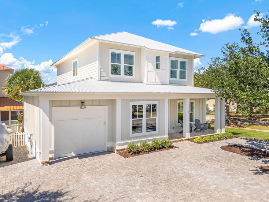 Welcome to 18 Heidi Heights Drive, a custom-built home in a gated community just a short walk from the beach. Every inch of this property reflects thoughtful design and timeless craftsmanship, with upscale finishes and upgrades in every room.From the 10-foot ceilings and crown molding throughout to the curated mix of accent walls featuring shiplap, wallpaper, and reclaimed Old Chicago brick, the attention to detail is obvious. Both the front and back porches are finished in the same reclaimed brick, creating a warm, welcoming first impression and a lasting sense of quality.The open-concept kitchen, dining, and living areas create an inviting space perfect for gathering and entertaining. The dining area features a striking brick accent wall with a sliding barn door, adding both character and functionality by creating privacy from the entry. The kitchen is a true showpiece, complete with a coffered ceiling, an oversized 11x4 island with built-in storage, cabinetry with pull-out shelves, an appliance lift, and under-cabinet lighting. The living area includes built-in bookshelves and offers a seamless flow that feels both spacious and comfortable.

With four spacious bedrooms, each featuring its own private en suite and custom closet, this home offers both comfort and functionality. There's also a versatile bonus room with cubbies and a separate room off the garage with built-in desks and shelving, perfect for a home office, study area, or craft room.

Designed with full-time living in mind, this property provides abundant storage options, including an oversized single-car garage, parking for up to seven vehicles, and a fenced backyard. An additional storage area beneath the back porch is ideal for kayaks, paddleboards, or beach gear.

The Village at Blue Mountain is a gated neighborhood that offers resort-style amenities just steps from your front door. Enjoy a large community pool, a fully equipped fitness center with machines and free weights, shuffleboard, a putting green, and bocce ball courts. At the neighborhood entrance, you'll find a variety of local dining options, including Mimmo's Italian restaurant, an ice cream shoppe, a coffee bar, and a Thai restaurant. More beloved spots like Red Fish Taco with live music, McTighe's Irish Pub, and Cowgirl Kitchen add to the vibrant local scene, all within easy walking distance. Best of all, this home includes deeded beach access less than half a mile away. Additionally, The Village at Blue Mountain Beach has access to both Highway 30A and 83, making it easy to explore everything the Emerald Coast has to offer.

This home is truly one to see to appreciate. Every detail has been carefully selected to create a space that's both beautiful and livable, just minutes from the sugar-white sands of the Gulf.