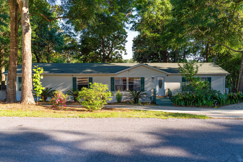 Don't miss this waterfront home on Lake Juniper! Nearby Cat Island Park offers a fishing pier and is great for kayaking. This home is situated on a large lot, with raised deck overlooking the lake. This 4 bedroom 2 bath home boasts all new luxury vinyl plank flooring, HVAC, and repainted in 2023. Water heater, stainless steel appliances, and all new decking replaced in 2024. Two outdoor sheds that offer plenty of additional storage. This property is ready for its new owner. So don't miss out on scheduling your showing!