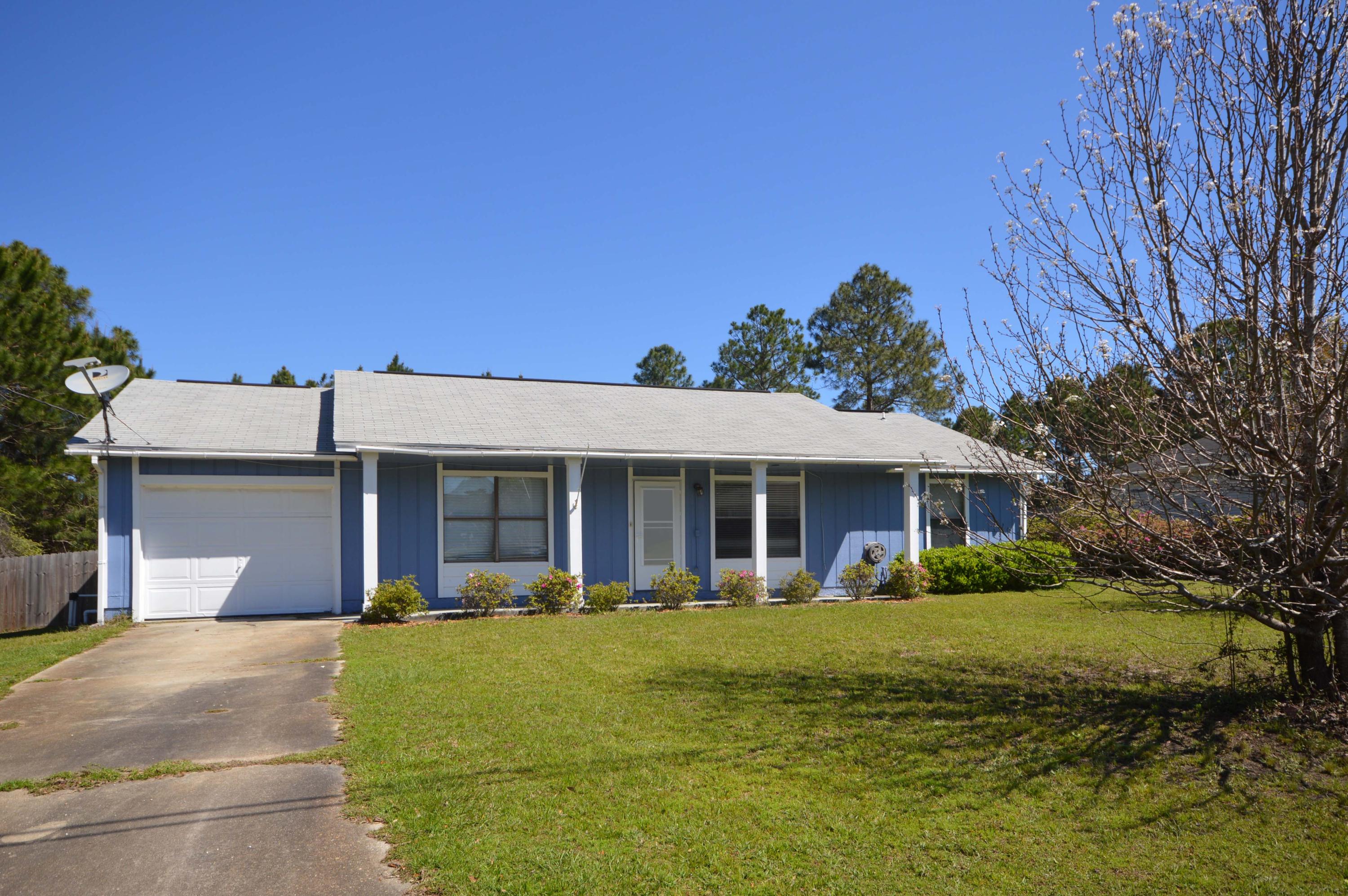 Location, Location, Location! This 3BR/2BA is a great starter home that is located just a few blocks North of the Publix Shopping Center in Navarre. Features include a split bedroom floor plan. Master bedroom has a nice sized walk-in closet. New engineered wood flooring in living room and dining room. Kitchen nook has built in wine rack and counter space for a coffee bar. French doors open to a 12x14 covered screened porch. All appliances convey. Home Warranty included.