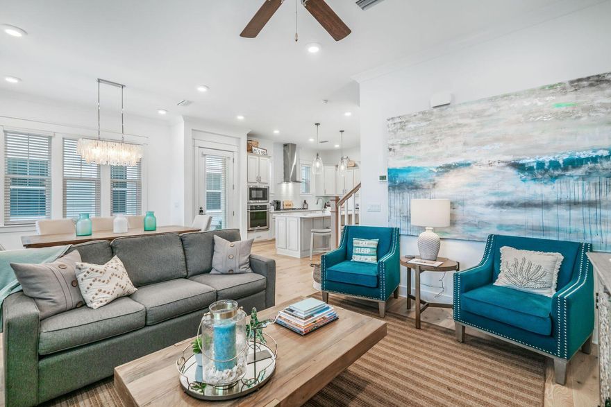 You will enjoy calling this stunning 3 bedroom/2.5 bath luxury townhome ''home'', a second home or a rental property. Offered fully furnished with a 6-seat golf cart, this Cozumel floor plan backs up to neighborhood preserve area and Point Washington State Forest. The first level welcomes you with an open, spacious living area with bright coastal colors that balance beautifully with the furnishings, granite counters, glass tile backsplash, and hardwood floors. The first floor includes the kitchen, living and dining areas, half bath, laundry room and an interior entrance from the two-car garage, great for storing your golf cart, bikes, boards, and beach toys. The first-floor luxury finishes continue throughout the second level bedrooms and baths. The primary bedroom is complete with