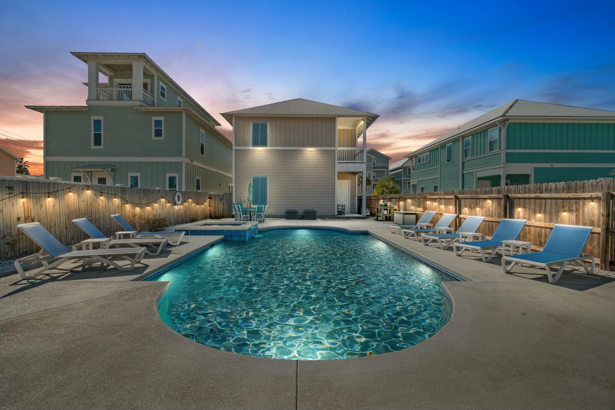 Come join us on ''Island Time''. This luxurious *all 5 star reviews* vacation rental ready, turn key, no HOA, two story beach house with a heated pool and spa with views of the Gulf of Mexico sleeps 15 (more if desired) and has actual rental income of $159,000 to date in 2024 with projections for 2025 of over $190,000! This home's thermostats, pool generator, pump and heater, indoor and outdoor lighting, irrigation, Ring doorbell, Ring security cameras located on the front and rear of the property are all Wi-Fi controlled by your cell phone anywhere in the world creating thousands of dollars in savings annually making this the perfect vacation rental, second home or primary residence. Located across the street from Beach Access 28, this home is literally steps from the soft, sugar white sandy beaches and emerald green waters of the Gulf of Mexico where you can relax and enjoy the sunshine in a low density area with other newer construction beach homes far away from the condominium buildings and no public parking nearby. Situated on a double corner lot, this home provides plenty of space for parking up to six vehicles on the paver driveway in the front and a spacious pebble tech pool with tanning ledge, digital auto water fill, spa and pool deck with eight pool lounge chairs, two high top Polywood tables and chairs, Polywood six seater table, Green Egg grill, plus a lawn large enough for outdoor games and activities enclosed by privacy fencing in the back. This home is also located just a short distance to two public boat ramps and three marinas for boating/fishing enthusiasts who prefer to spend their vacation on the water. Beach, Bay or Gulf, so much to do! There are many opportunities in this area to rent a boat, golf cart and other recreational vehicles to make your experience here the very best it can be. This home is within a short walk down the beach to Pineapple Willie's Restaurant, Bar and Pier with seasonal live music and a short drive or bike ride to Signal Hill Golf Course, St Andrews State Park, Schooners, Patches, Captain Anderson's, Grand Marlin, Off the Hook, Christo's, Panama Pizzeria, Andy's Flour Power, Pineapple Willie's and Mrs. Newby's. All favorites of the locals here. There are plenty of sidewalks to walk, run and bicycle as well. This home greets you with a welcoming front porch with tall columns, tastefully colored hurricane shutters and rocking chairs. The integrated blind glass double doors open to a luxurious open concept space that is breathtaking. This well-appointed home boasts neutral, luxury tile plank flooring, crown molding, 10' ceilings and customization throughout. This kitchen really is a chef's dream with upscale appliances to include a Thermador gas range, Thermador dishwasher, SubZero refrigerator, Scotsman ice maker, built in wine caddy, granite countertops and breakfast bar/kitchen island, custom cabinets, pantry, and custom tile backsplash.  The breakfast bar and the dining table both seat six for a total of 12 spaces. The washer and dryer are just off the kitchen. Also located on the first floor is the 1st guest bedroom with double full size bunkbeds connected to the guest bathroom with tiled shower/tub combo and gorgeous granite single vanity. Just up the wooden staircase to the 2nd floor you will find the same luxury tile planking flooring, crown molding, 10' ceilings and more customization. The bunk nook includes a twin over a full bed with mounted TV and nightstand, hall bunk with twin over twin, the 2nd guest bathroom with tiled shower/tub combo and gorgeous granite single vanity, the 2nd and 3rd guest bedrooms both with full sized beds and the master bedroom with ensuite. The spacious master bedroom with king size sleigh bed, huge walk-in customized closet, ensuite with double granite vanity and spacious, glass enclosed tile shower is second to none along with the adjoining front balcony perfect for enjoying the mesmerizing Gulf views. Verify measurements if important.