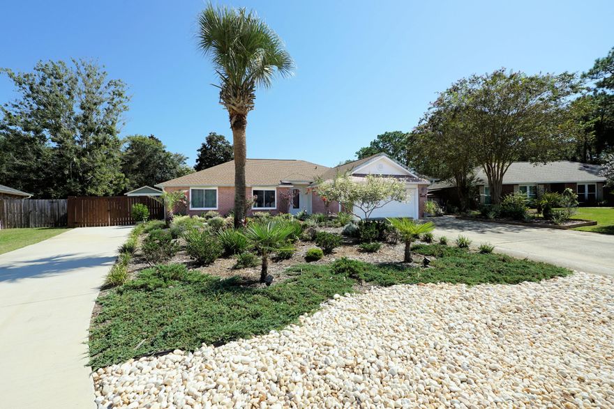 Turnkey Perfection in Sought-After Raintree Estates. This fully updated 3-bedroom, 2-bath home offers modern upgrades, exceptional comfort, and a location that's second to none. 2025 improvements include a brand-new roof, impact-rated doors & windows, a luxurious walk-in shower in the master bath, new PTAC unit for the sunroom, and a covered patio for shaded outdoor living. Wake up to breathtaking sunrises in your heated & cooled 400 sq. ft. sunroom--the perfect year-round retreat for morning coffee or evening relaxation.  Within the last 3 years, the home has been enhanced with: 18 SEER Platinum Series HVAC for energy efficiency, 50-gallon WiFi-enabled smart water heater, Mohawk waterproof laminate flooring throughout, beautifully updated bathrooms and fresh interior paint in neutral tones. The generous, fully fenced backyard is landscaped for low maintenance and maximum enjoymentideal for BBQs, play, or pets. Need space for your toys? A second driveway accommodates an RV or boat up to 45' behind a privacy double gate, plus a site-built 12x16 storage shed keeps tools and gear neatly tucked away. Located in the highly desirable Raintree Estates, you'll enjoy: Top-rated schools, Friendly, walkable streets & a community dock as well as easy commutes to nearby military bases, quick access to shopping, dining, and the Gulf Coast's white-sand beaches. This move-in-ready home blends quality upgrades, thoughtful details, and a prime locationperfect for busy professionals and military families who want style, convenience, and peace of mind. Don't waithomes in Raintree Estates move fast. Schedule your showing today!