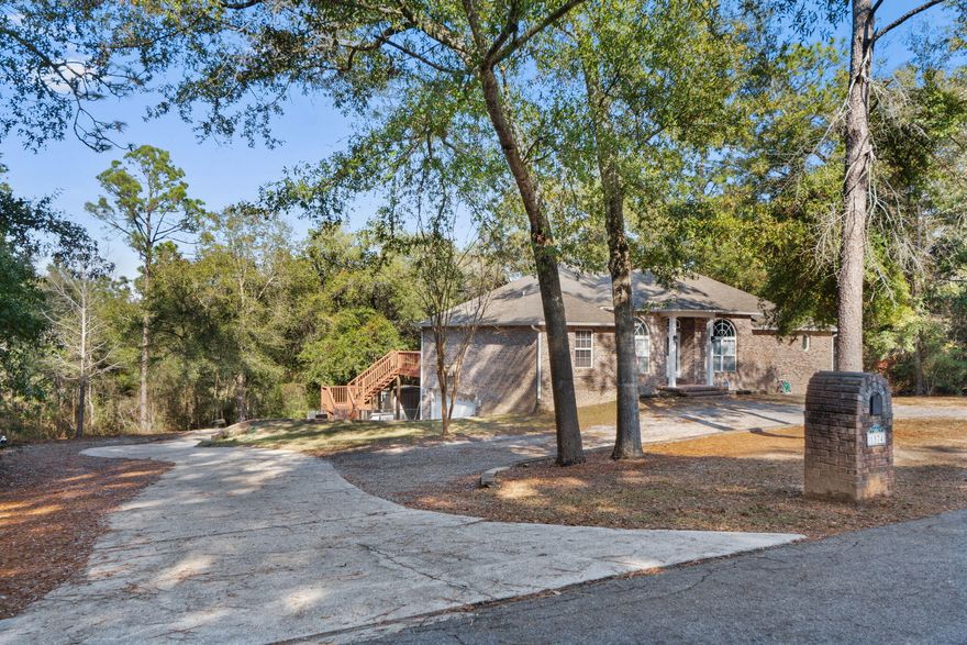 Multi-Generational Living, Spacious Home, True MIL Suite! Endless Possibilities! Upstairs features a split floor plan with a large owner's suite off the kitchen, two bedrooms and bath off the living room, plus a dedicated office and formal dining. Enjoy a gas fireplace and stove, the double doors leading to an expansive deck with gas and water hookup, bring your hot tub or out door kitchen, perfect for entertaining. Down stairs MIL suite is accessible via a spiral staircase with a locking door at the base for privacy, plus two separate ground level entries, french doors open to the back yard. It offers a full kitchen, living/dining, bedroom, bath, and bonus space for games or crafts.  Additional workshop storage is attached to garage. Centrally located near schools, shopping, and Highways