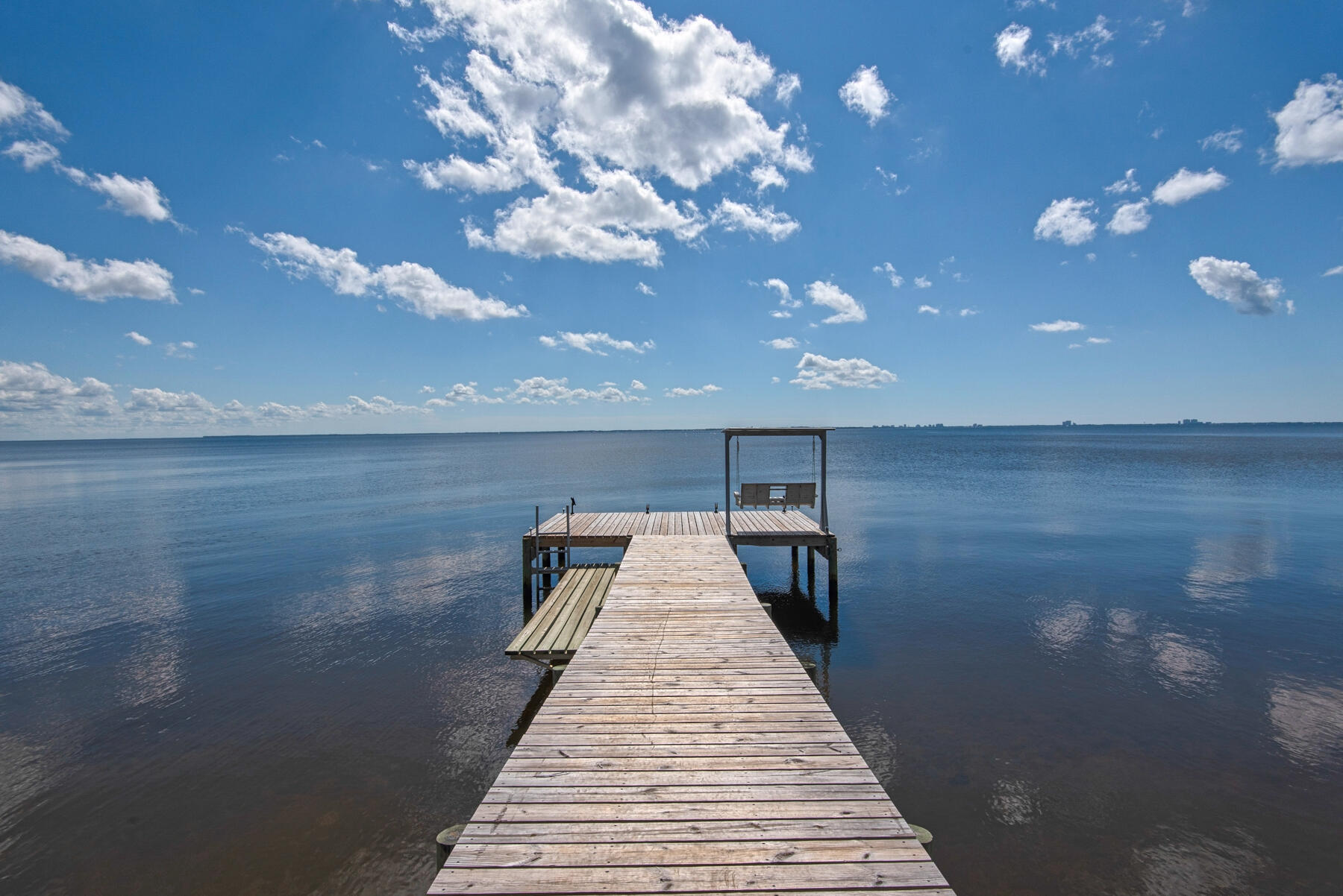 Words cannot describe this amazing piece of paradise.  As your car rolls through the gates you are immediately gifted with the most amazing vista!  The high and dry double lot w/ over 180 feet of private shoreline AND NO flood insurance is necessary! The Lot was elevated during construction allowing you can take advantage of all that Choctawhatchee Bay has to offer while still protecting the home.  The home has been oriented on the lots in a way that allows you to take in the dolphins at play and the amazing sunrises and sunsets from just about every room!  No detail was skipped in the design of this home.  Outstanding finishes in every room of the home including beautiful floors, gorgeous custom cabinetry and fabulous granite.