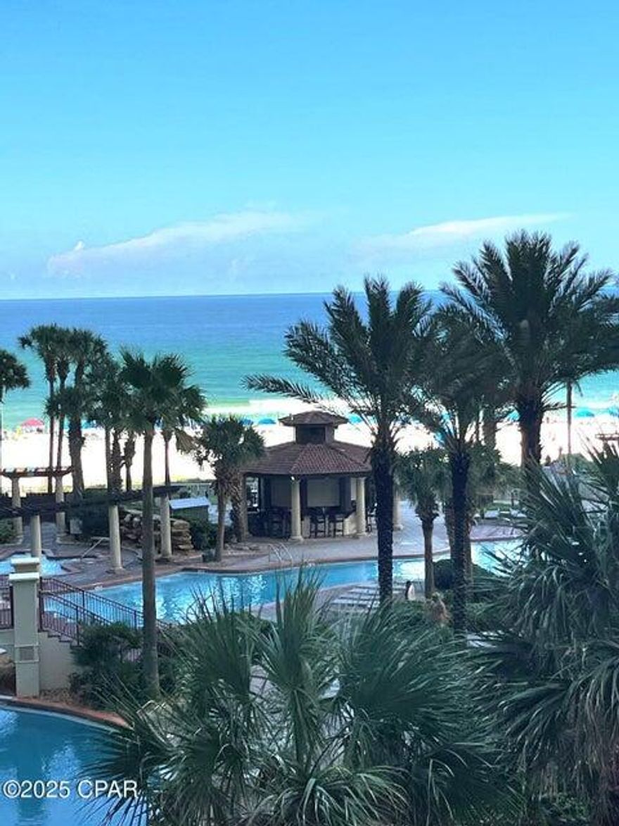 Welcome to The Shores of Panama! - Breathtaking turquoise water views, premium amentities and an unbeatable location!!! This fully furnished 2 bedroom, 2 bathroom is located on a prime low floor in the highly sought-after Shores of Panama. Freshly painted from ceiling to floor, this condo is move-in/rental ready. Enjoy the lively pool & Tiki bar scene, or kick back on your balcony and take in the perfect people-watching spot from your low-floor view. Either way, you'll feel like you're in the heart of the action without sacrificing comfort or privacy. The Tuscany-style resort offers 24-hour security and amenities galore -- multiple lagoon-style pools, hot tubs, a full fitness center, tiki bars, private beach access and a primo same-floor dedicated parking spot right outside the doors for ultimate covenience!! And when it's time to explore, you're right next door to the world-famous Pineapple Willy's and Parlors Donuts, plus walking distance to mini golf, bowling, arcades, shopping, and so much more! Whether you're looking for a performing investment or your own piece of paradise, this unit checks every box! Low floor, oceanfront views, premium parking, and location, location, location!