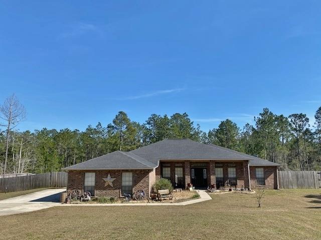 You must See this 4 bedroom/2 bath all brick home, with heated and cooled Florida Room, (included in square footage), on 1.23 acres! Incredible eat in, tiled kitchen with island, tons of cabinets, breakfast bar, and separate dining room. Vaulted ceiling has 2 beautiful, knotty pine beams. New Luxury Vinyl Plank flooring throughout. Carpet in bedrooms. Split bedroom floor plan. Large Master bedroom with treyed ceiling. Master Bath has double vanities, separate shower, garden tub and walk in closet. 3 car garage has tons of space with pull down stairs & attic flooring. Extended Concrete Slab behind gate for RV parking with 50 amp service. Stately Driveway has been widened for yet more parking. Shed, cleared lot, w/fence and decorative pond. Termite Bond in place. Call to see this beauty!