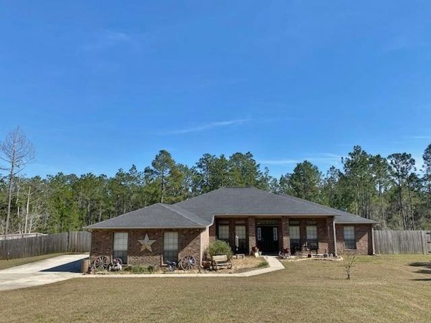 You must See this 4 bedroom/2 bath all brick home, with heated and cooled Florida Room, (included in square footage), on 1.23 acres! Incredible eat in, tiled kitchen with island, tons of cabinets, breakfast bar, and separate dining room. Vaulted ceiling has 2 beautiful, knotty pine beams. New Luxury Vinyl Plank flooring throughout. Carpet in bedrooms. Split bedroom floor plan. Large Master bedroom with treyed ceiling. Master Bath has double vanities, separate shower, garden tub and walk in closet. 3 car garage has tons of space with pull down stairs & attic flooring. Extended Concrete Slab behind gate for RV parking with 50 amp service. Stately Driveway has been widened for yet more parking. Shed, cleared lot, w/fence and decorative pond. Termite Bond in place. Call to see this beauty!