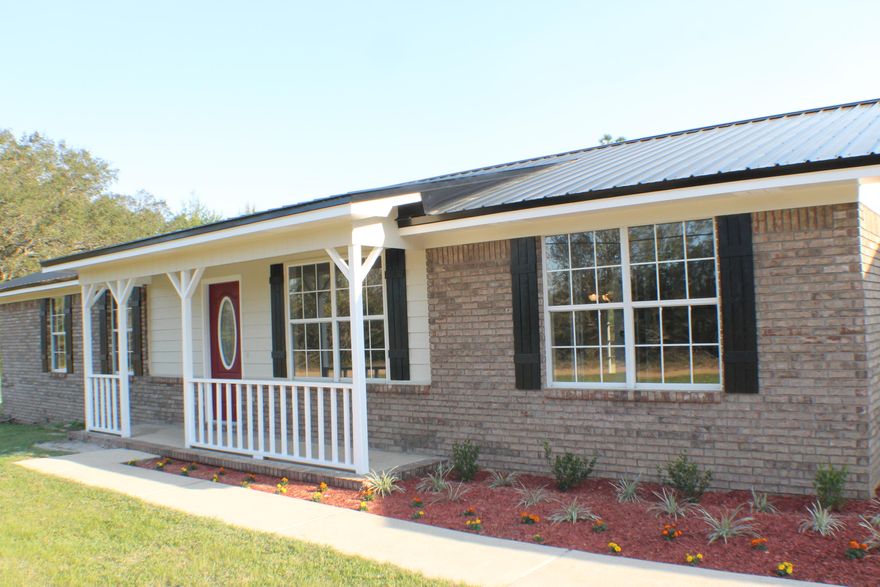 Country living right outside of town! Surrounded by 23 acres of woods and a horse farm right across the street. This 3 bedroom 2 bath brick home sits on a leveled 1 acre lot and has been completely renovated in 2016! WHAT'S NEW: Metal Roof, Goodman 3 ton complete HVAC system, Spanish lace ceiling and walls, blown in insulation in attic 2 18 inch deep tubs, showers, toilets, vanities, mirrors, light fixtures, tiled walls and floors, ceiling fans, baseboards, paint, six panel doors, French door, front door, 2 side doors, all hardware, carpet and padding, laminate wood flooring, tile, hot water heater, kitchen cabinets and backsplash, granite counter tops, stainless steel appliances, shelving, lighting, 2 garage door openers, exterior paint, and 4 inch deep well (no chlorine). Your NEW