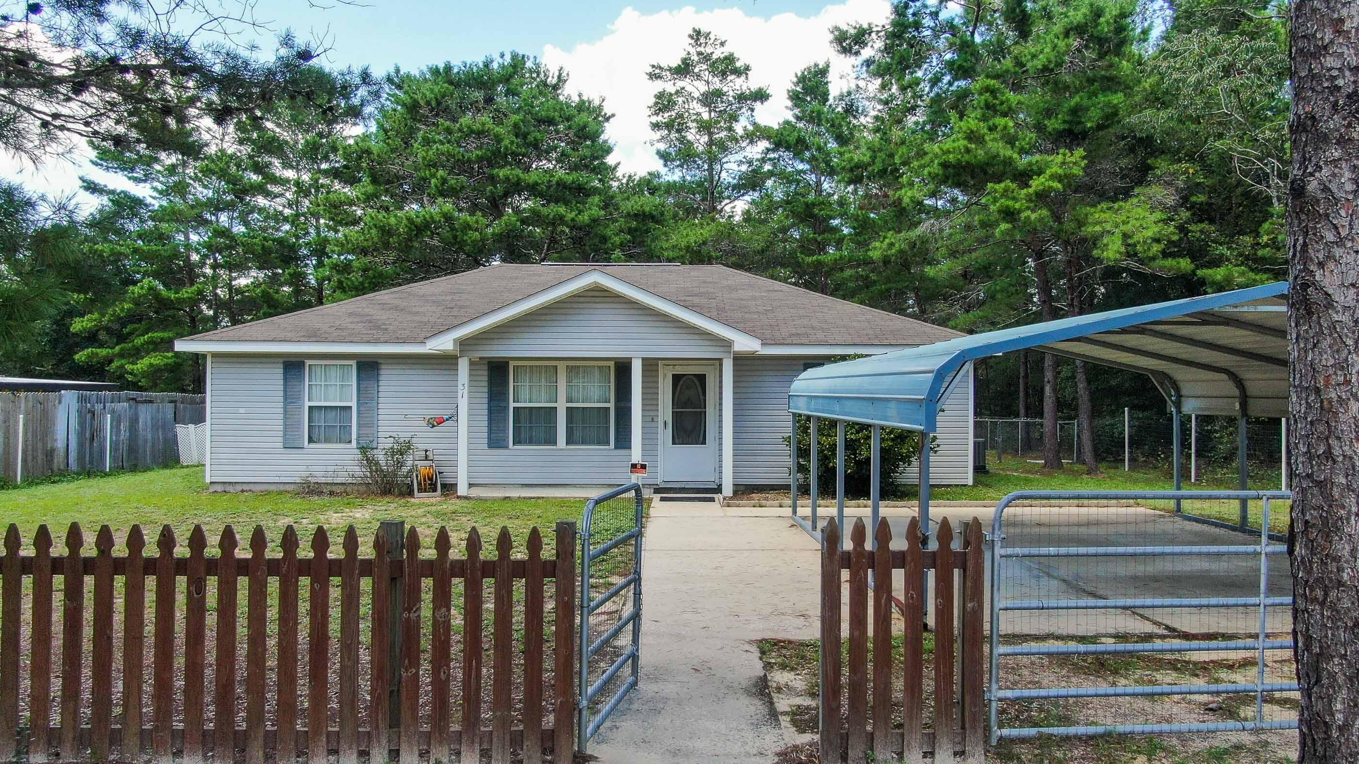 Neat and clean 3 bed/2 bath with fenced yard located in the growing Mossyhead area between DeFuniak Springs and Crestview. Open, split floor plan with vaulted ceilings making it feel even more spacious. Galley style kitchen with maple cabinets and all appliances included. The back yard is fenced with a small storage building on appx 1/4 acre. It's hard to find homes in this price range that qualify for all financing types, so don't delay!
