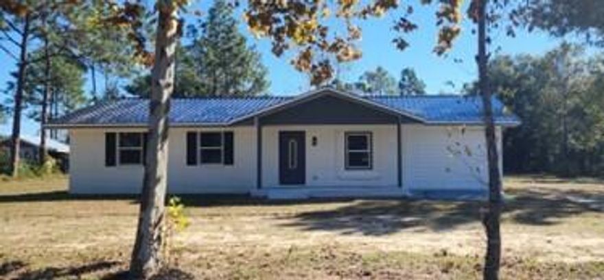 No HOA! Home is on 1 acre. This renovated home has tons to offer a new buyer and is move-in ready.  New double pane windows, AC, and hot water heater. The roof has been inspected, all new screws were installed.  Kitchen has new cabinets, stainless steel appliances and a clean fresh look. Luxury Vinyl Plank flooring is throughout the home.  The bathroom has been updated with vanities, toilets, tub, surround and plumbing fixtures. All light fixtures are new including switches.   Bonus room can be easily converted into a 4 bedroom, or use as a playroom, office, or man cave.  Seller is offering $10,000  in buyer closing cost, prepaids, escrow or points.