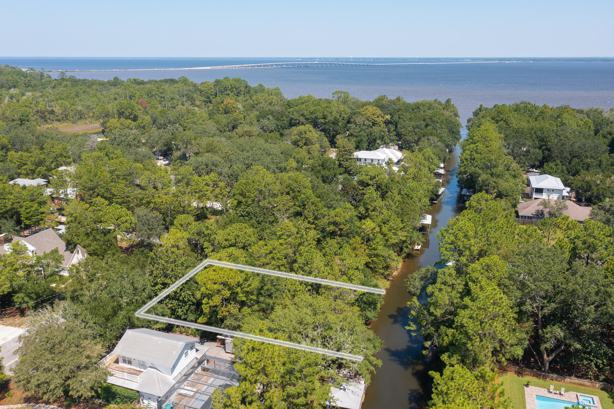 This waterfront lot offers the best of both worlds with the bay and beach at your fingertips. This large waterfront lot is located in The Daughettes; just a few minutes from the beautiful beaches of South Walton and all the restaurants and activity of 30A. The Daughettes is quickly becoming one of the more sought after areas in Point Washington with new homes, docks and boat lifts popping up every day. This lot is a blank canvas for someone wanting to create their own spot on the water. The canal is deep enough to accommodate bay and gulf ready boats. Once you leave the mouth of the canal, either head west to Destin, Crab Island and the Destin Pass or east to the intracoastal waterway to Panama City Beach and Shell Island. The location is private but close to it all!