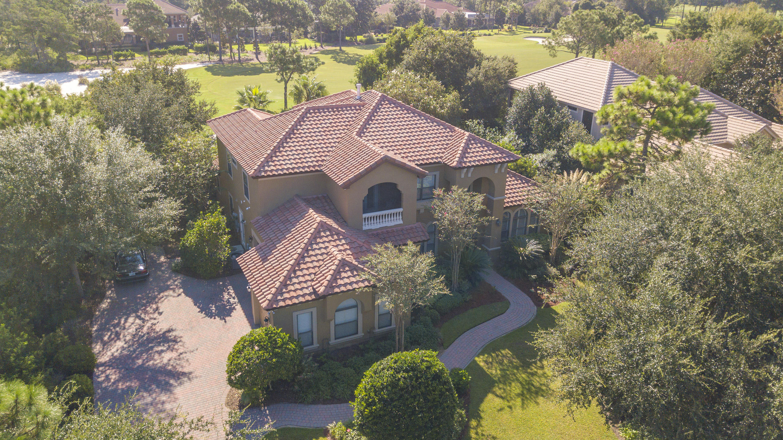 Back on market at no fault of seller. Must see beautiful and spacious home overlooking the 11th fairway in the exclusive Kelly Plantation community. Countless upgrades and custom finishes include raised ceilings, arched doorways, built-ins, travertine floors, granite, 3 fireplaces, true 3 car garage and much more. Any cook will feel at home with the professional appliances and large walk-in pantry. The lanai area boasts an outdoor oasis with summer kitchen, multiple seating areas, gas fireplace, pool and hot tub. The master and guest wings are situated on the first floor with 3 additional bedrooms and media room upstairs. The media room comes complete with 100 inch screen, projector, fireplace, wet bar and large screened porch.