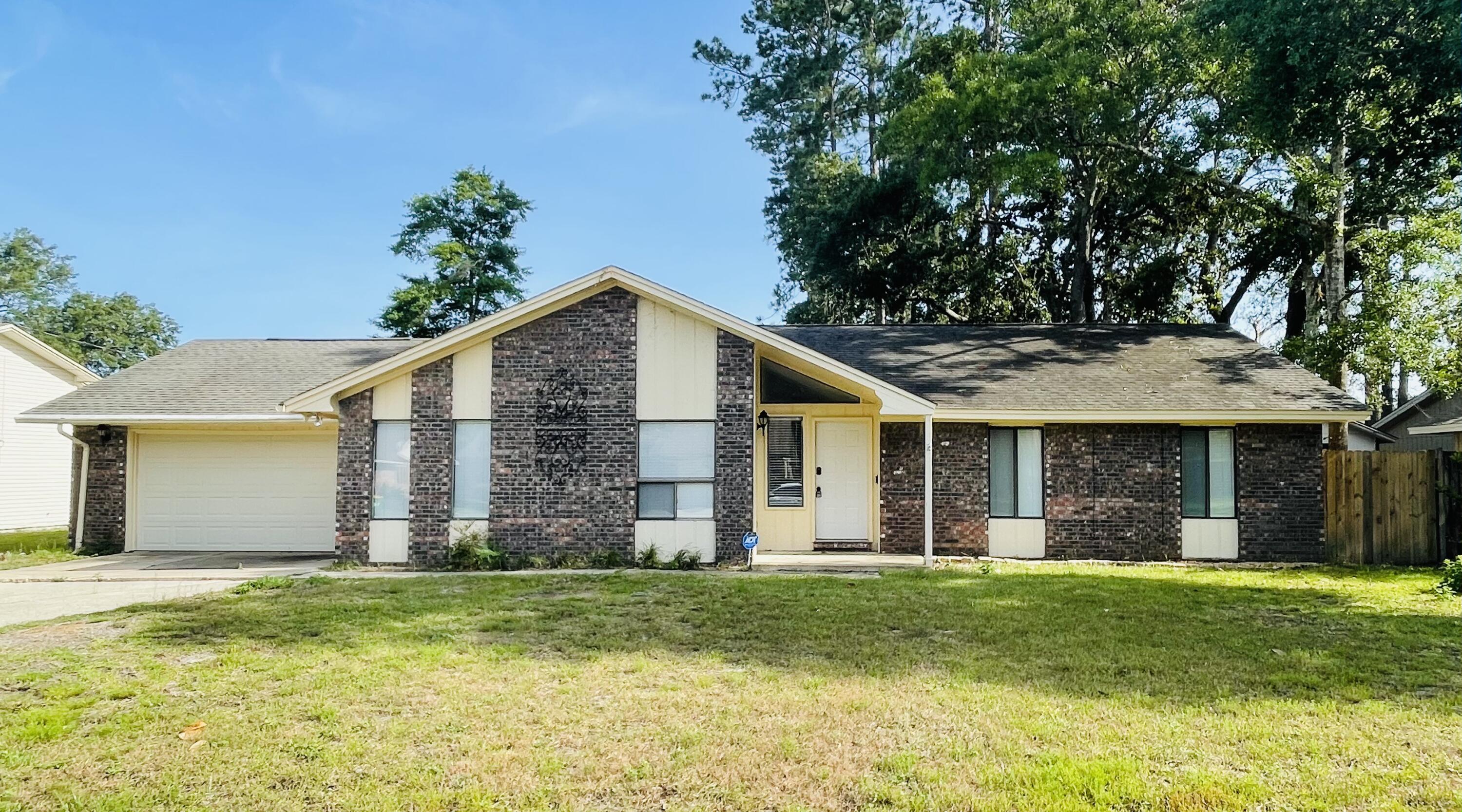 Wow, Roof will be replaced before closing!NICEVILLE WAS JUST VOTED THE SAFEST CITY IN FLORIDA! Minutes from the base in the heart of Niceville and just over the bridge is Destin. Charming home with many upgrades featured in the heart of Niceville. 3 Living areas in this spacious home. 3 bedrooms and 2 baths. Kitchen and bathrooms have been renovated tastefully. Laminate and tile flooring throughout the home. Galley style kitchen with black stainless-steel appliances, large laundry, eat in kitchen, wood burning fireplace and more. Nice foyer with custom wall tree. Neutral tones in the home with natural light. Large backyard with privacy fence.