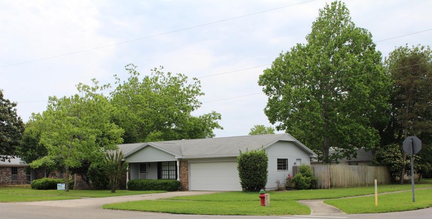 In the heart of Destin and convenient to schools, shopping, restaurants, recreation and more. Brick home on corner lot has 4 bedrooms and 1 3/4 baths. Home is sold ''AS IS'', has a fenced in backyard with mature fig tree. All bedrooms and living room have carpet and vinyl flooring in the kitchen, bathrooms and entryway. Tiled shower in the master bathroom , single vanity with formica countertop. The guest bathroom has a tub/shower combination with tile surround. Kitchen has wood cabinets and formica counter tops This ranch style home has a two car garage with partial brick and vinyl siding. Additional parking in driveway.