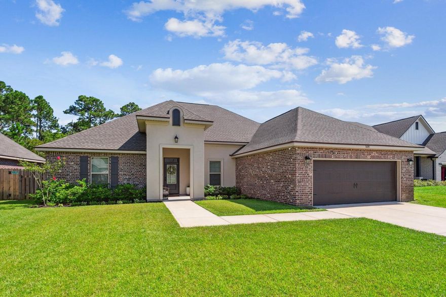 OPEN HOUSE!!! SATURDAY 5/24 from 11am-2pm. Ideally located near highly rated schools and just minutes from Pensacola Beach and Navarre Beach, this pristine 4-bedroom, 3-bathroom home blends modern comfort with stylish upgrades. Featuring a spacious open-concept, split floor plan, this home is designed for today's lifestyle. Step inside to luxury wood-look tile flooring that flows seamlessly throughout, complemented by elegant blinds and eye-catching quartz countertops in both the kitchen and bathrooms. The kitchen is a chef's delight, showcasing upgraded cabinetry with generous storage, a large island with bar seating, stainless steel appliances, and a gas range. Thoughtful upgrades include a welcoming mudroom with a built-in boot bench, detailed crown molding, a cozy gas fireplace, and a low-maintenance brick and Hardie exterior topped with durable 30-year shingles. Retreat to the luxurious primary suite, which features a spa-like bathroom with a custom-tiled shower, a soaking tub, and an oversized walk-in closet complete with custom shelving. Out back, enjoy a fully fenced yard, a covered patio perfect for entertaining, and a private well-fed sprinkler system. Energy efficiency abounds with Low E MI windows, a high-efficiency Carrier HVAC, central gas heating, and a Rheem tankless gas water heater. Nestled in The Sanctuary on Soundside, a private 27-lot community, this home offers a peaceful setting just steps from the Santa Rosa Sound and minutes from a public boat launch.