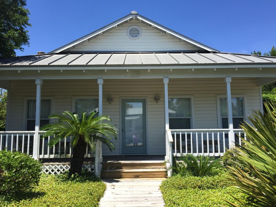 Coastal living just doesn't get any better than this! This quaint and cozy 2 bedroom, 2 bathroom cottage is just a 3 blocks from some of the most beautiful beaches with sugar white sand and emerald green water. Location is everything with this property as it is just minutes from The Destin Commons and all of the best shopping and dining venues. The specious living area boasts beautiful wood floors and the perfect dcor/furnishings for your very own Florida cottage which can be negotiated in the sale. Relax on the large covered front porch and enjoy the breeze while watching a gorgeous sunset. This home is a MUST SEE and won't last long so make your viewing appointment today!