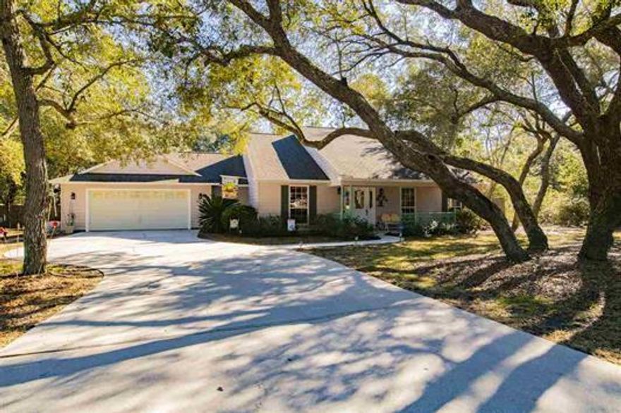 Nestled in the desirable neighborhood of Holley By The Sea on .69 acres, this 3 bedroom 2.5 bathroom home has so much to offer! Upon arrival, you'll note the beautiful live Oaks in the front yard providing ample shade. The spacious back yard features an in-ground pool with a Jacuzzi, open lanai, and a plethora of Live Oaks and Camellias. The entire back yard is privacy fenced with an addition ranch style fence dividing the remainder of the partially wooded area, making for a real natural feel. Enjoy entertaining guests in the screened enclosed patio as well as the sun room with sliding glass doors which open to the back yard. The kitchen comes equipped with beautiful granite counter tops, mosaic glass tile back splash, wall oven, built-in microwave, pull-out shelves, deep drawers, breakfas