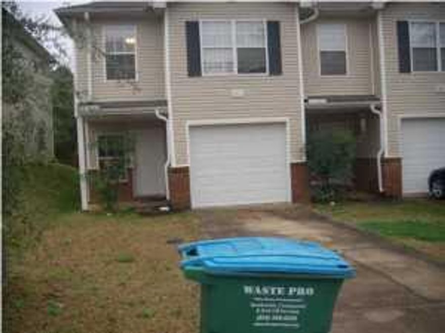 End unit with ceiling fans in living room and bedrooms, hard surface flooring downstairs, carpet in bedrooms. Master suite with a walk in closet and spacious bedrooms. Washer & dryer hook up. Lawn maintenance taken care of by owner.
