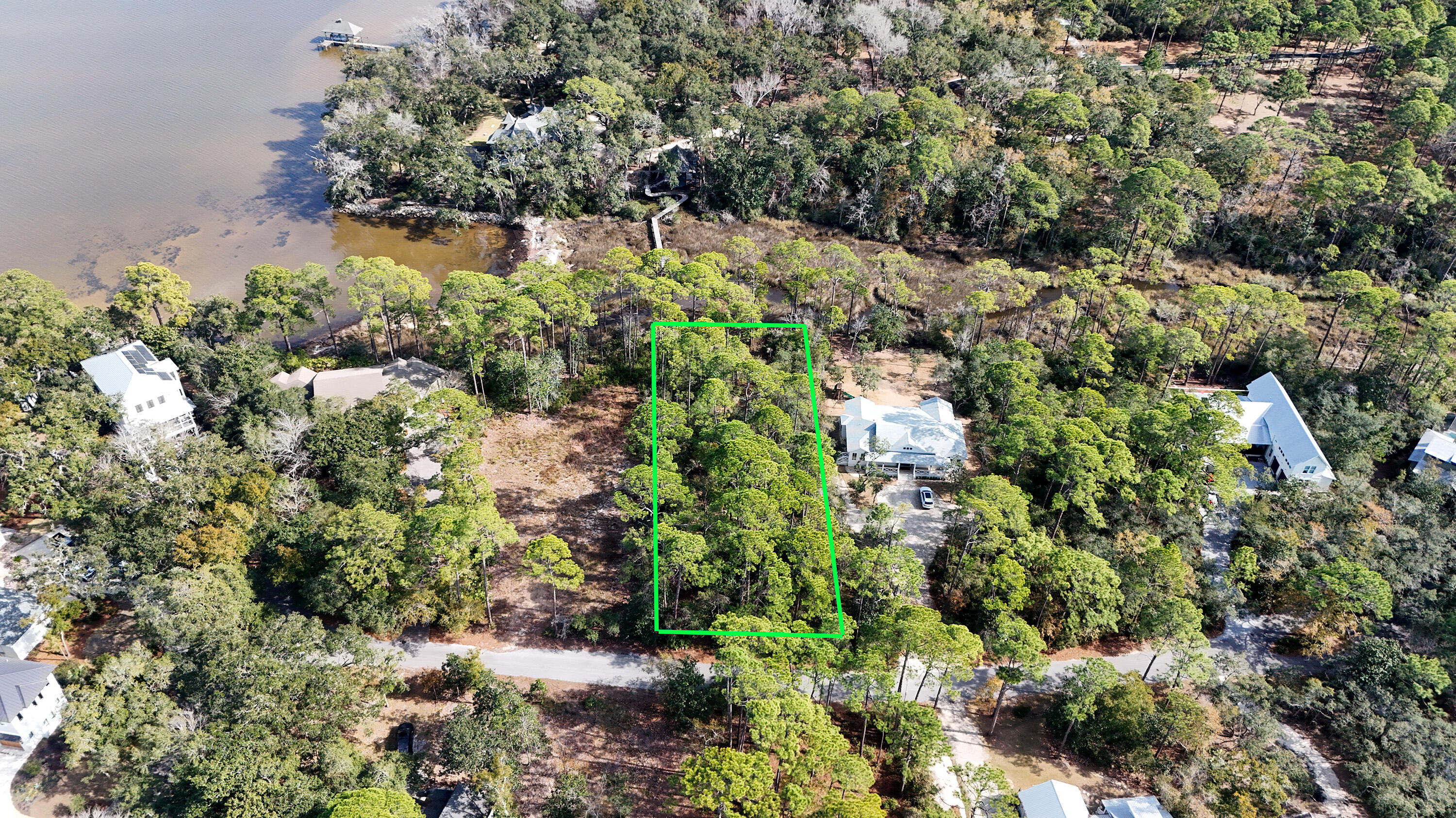 Create your ideal waterfront retreat on this expansive 0.68-acre bay-view, bayou-front lot in the serene Eden Bay Estates. Towering oaks line the quiet streets, enhancing the charm and tranquility of this exceptional setting. A small canal connects the property to the open bay, providing easy access for paddling and waterfront adventures. Just a short drive away, the vibrant 30A lifestyle awaits--offering world-class dining, boutique shopping, scenic bike paths, and lively cultural events. Plus, with the stunning white-sand beaches only minutes away, you can enjoy the perfect balance of relaxation and coastal excitement. your dreams and building plans. This is a unique opportunity to build in Eden Bay Estates, Lot is level  with plenty of room for your building plans.