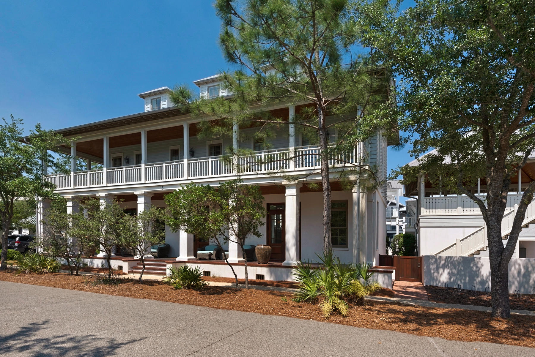 Rosemary Beach living at it's best. This bright spacious 3 level home features open living, dining and kitchen all on first floor. Spacious wrap around porches extend the living area even more accommodating large families and your guests. This home is a beautiful example of architecture with large windows, a central featured stairway and stylish finishes. The master suite opens to the second level covered porch. Two additional guest rooms are on level 2 with access to the front covered porch. The third level features 2 additional bedrooms each with a built-in sleeping nook. The 2 level double garage is topped by a large open air porch equipped with plumbing and another bathroom. This space was thoughtfully designed for the eventual conversion to a Carriage House.