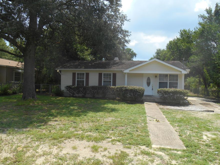 Welcome to this attractive 3 bedroom home on a .26 acre level lot with mature trees that provide great shade. Don't let the age fool you; it was totally remodeled in 2007 and the Property Appraiser lists an effective age of 1980. Newly painted and has a bright, open living room, dining room and kitchen. The ceilings have knockdown texture and there is orange peel on walls. There is a French door leading to a nice sized deck overlooking the backyard. The laundry room is on the inside and the HVAC replaced April 2013. The remodel included 30 yr shingles * Windows * Doors * Sheathing, house wrap and Vinyl siding for the outside. On the inside - All New Electrical Wiring, fixtures (installed panel larger than required for future additions) * All Plumbing Fixtures *