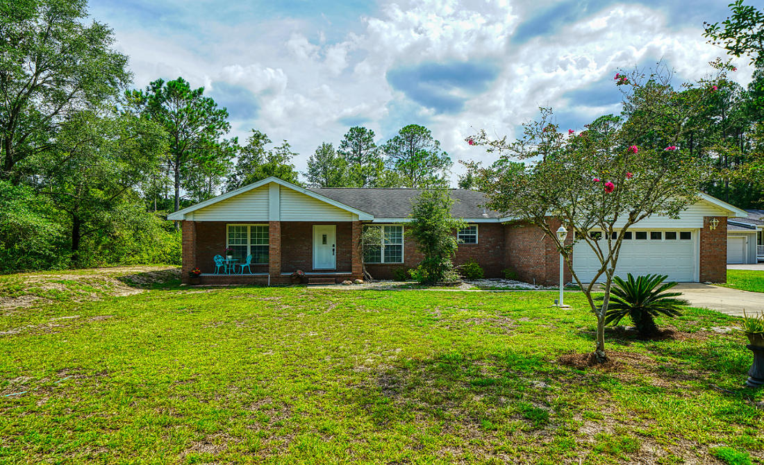 NEW PRICE, WATERFRONT and LOCATION just off Highway 331, south of Hwy 20! No wasted space in this Charming Brick Home and waiting for new owner! Three Bedrooms plus additional Flex Room and Two Baths. Open Great Room with Cathedral Ceiling and view of waterway. Easy working Kitchen and Dining Room Plan. Tray ceilings through-out add a nice touch. Split bedroom plan, foyer and extra closets for storage. Great Floor Plan - again, no wasted space in this home! Relaxing covered porch on the back for cook-outs and fish-fry gatherings. Large backyard and plenty of room for a pool. Dock and kayak stand already in place - bring your boat, jet skis, kayaks and paddle boards! City water & sewer in place. No HOA fees or requirements. Take a look and envision your new waterfront life!