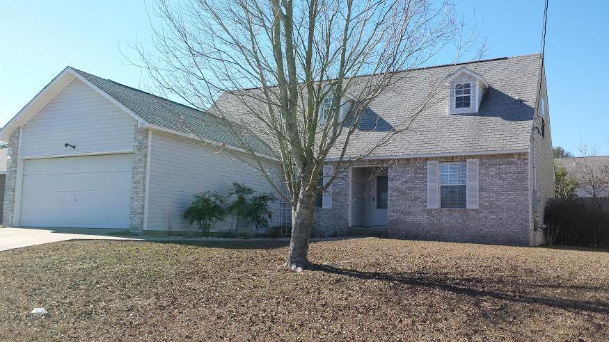 Your new home is this spacious 4 bedroom home with 3 full bathrooms in South Crestview. Need I say more? Can do! As you enter the home from the front door you are greeted by a generous, open and inviting space. You will love the hardwood floors in the living room and dining area. The kitchen has a plethora of cabinet space, counter space and a breakfast bar! Bedrooms on the first floor are on a split plan with 2 substantial additional bedrooms on either side of a full bath. The 1st Master Suite (Yes, that's right.This home has 2 master suites. One on each floor!) is located conveniently just beyond the kitchen and boasts plenty of room and closet space. The upstairs master is huge and features 3 roomy closets and a split vanity plan in the full bathroom.