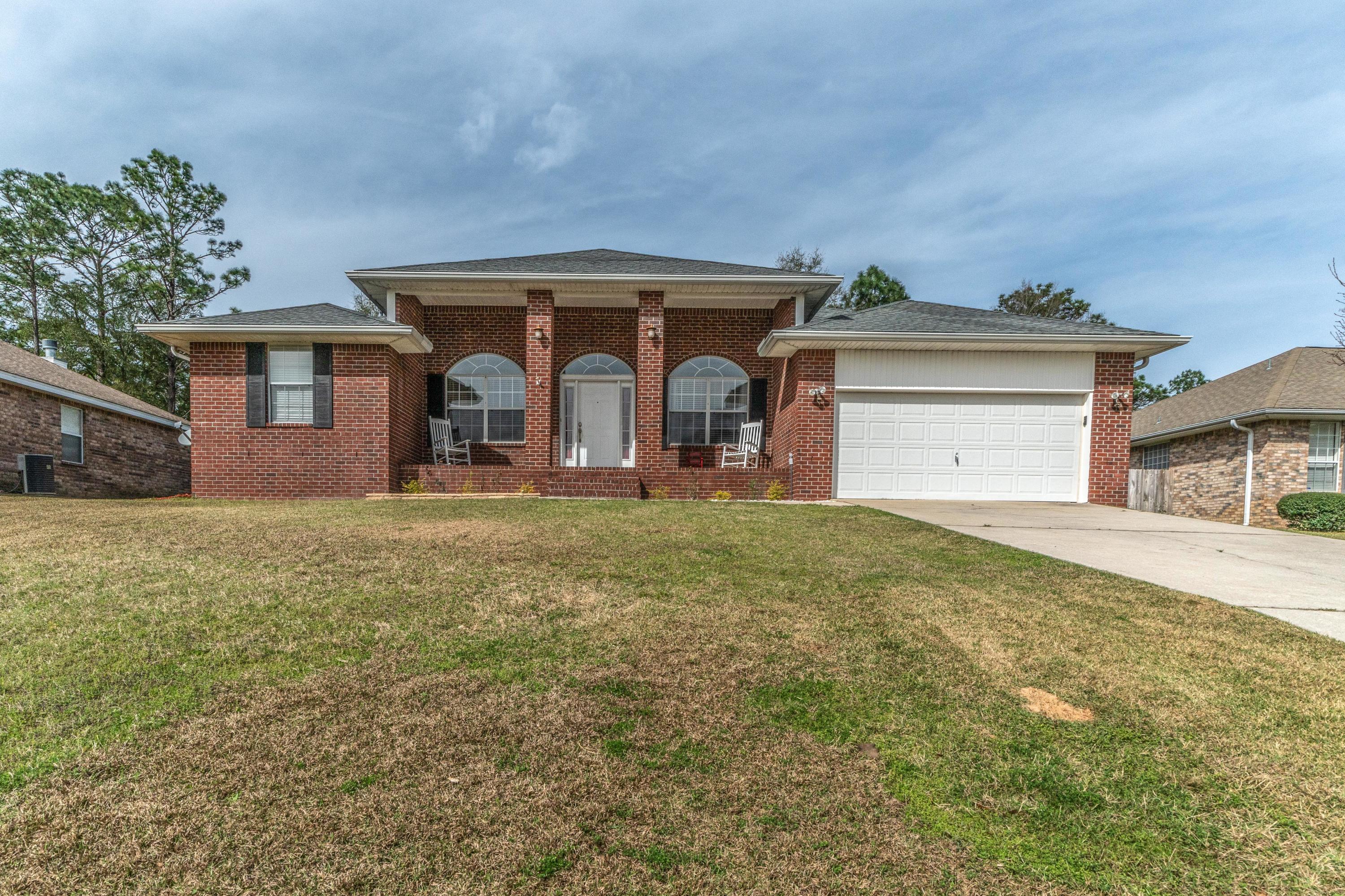 Situated on a three quarter acre lot in Crestview sits this nicely stated contemporary style brick house in the Silver Oaks subdivision. With an expansive floorplan of nearly 2200 square feet, this home boasts 5 bedrooms, 2 full bathrooms, tall ceilings, wonderful details large tile flooring, chair railing, granite counter tops in the kitchen complimenting the stainless steel appliances, fresh painted walls, new carpet and much more. The master bedroom is large with a generously sized ensuite with its own access to the back patio for easy access to enjoy the summer nights. Come see this fantastic property for yourself and consider this house for your next home.