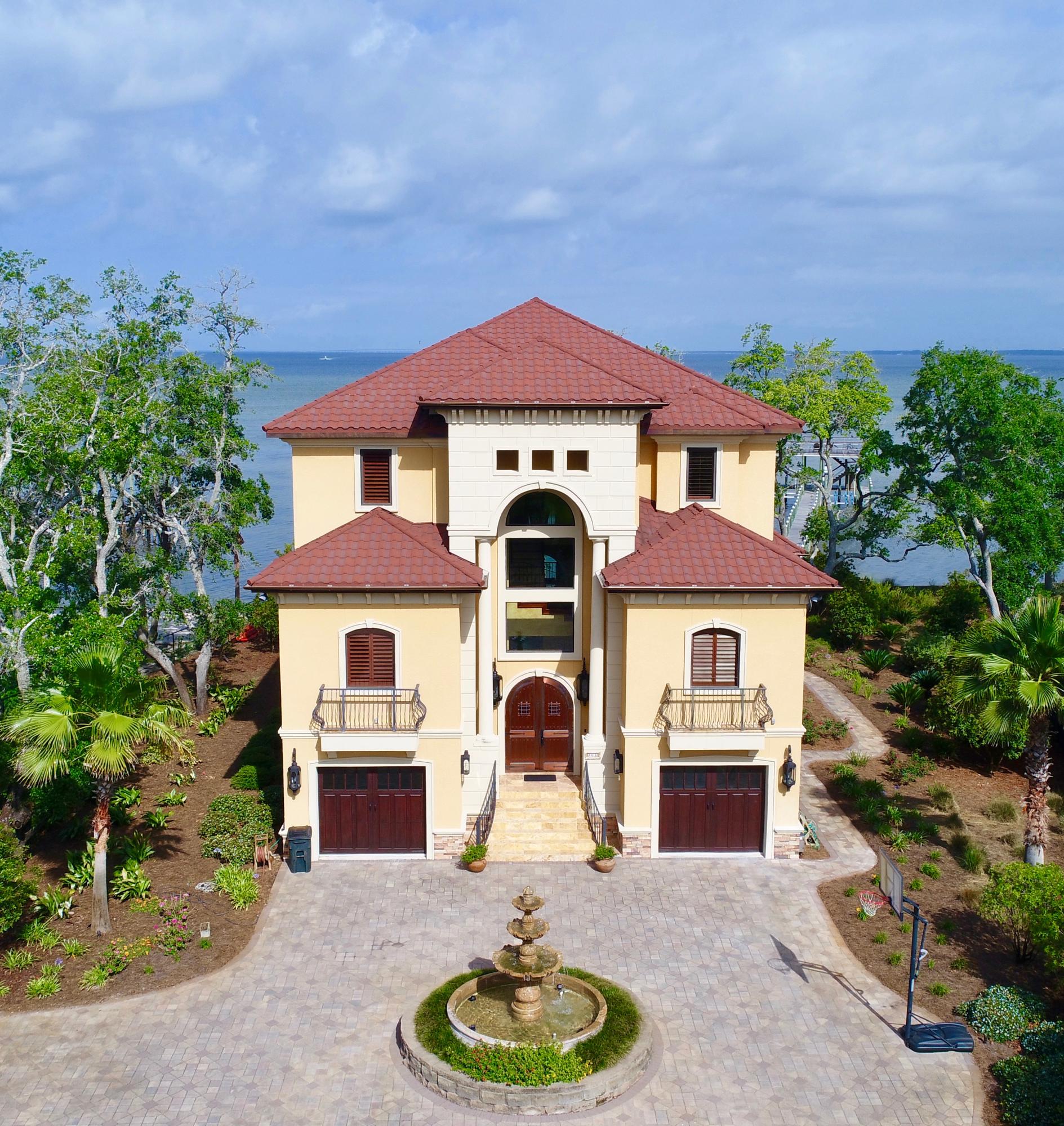 BREATHTAKING VIEWS! ONE OF A KIND WATER FRONT ESTATE! Tuscan Style home on extra large water front lot on the Choctawhatchee Bay. This home is built like a fortress. Commercial Construction. Red Iron, Light Gauge Steel and Concrete Construction. Energy efficient with closed cell foam through out, including walls, ceilings. Three inch reinforced concrete on floors/ceilings. 205 ft long dockunibody construction with extra large pilings and cross bracing. Approx. 1500sqft of dock space. Boat lift for a 35 ft boat, 2 jet ski lifts, under decking, special design fish scaling sink and storage area. Screened salt water pool with hot tub. Large outdoor kitchen with granite countertops, cypress cabinets, Viking Grill