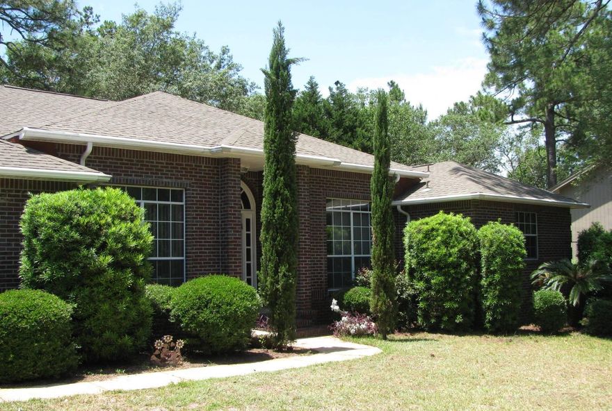 Privacy is yours in this Custom Built home located on the 9th hole of golf course. This 4 bedroom home/one being used as office leads into large family room with gas fireplace with 10' ceilings. Leading to 37' covered porch and views of golf course. Kitchen with 49' cabinets with Granite Counter tops installed April 2016. This home offers a Breakfast area in kitchen along with formal dining room. Split floor plan with Large master suite. Double closets, separate his and her vanities with Shower and garden tub. Roof replaced 2006. Freshly painted. Wood flooring throughout with exception of Bedrooms and Bathrooms. 160 feet on the golf course with great views and privacy with no one behind you. 3 car with one garage door extra tall for van or Boat on a trailer. All Brick Home