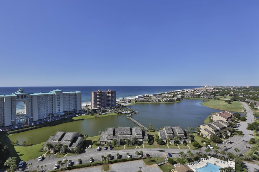 Amazing Southwest Coastline Gulf views for miles! Very few buildings have what Ariel Dunes II has to offer. Fantastic views of the Gulf, panoramic views of Destin, numerous amenities, and updated construction are just a few to mention. This 18th floor two bedroom/2 bathroom unit is sold fully furnished and has a relaxed modern decor, 9' ceilings, ceramic tile in foyer, hall, kitchen and baths, granite kitchen counter tops, and an additional outside storage unit you only get in Ariel Dunes II. Enjoy beautiful Gulf views from the living area and master suite; both with sliding glass doors to the private balcony. The building also boasts two large pools totaling approximately 12,000 square feet as well as convenient deeded access to over 2,000 feet of white sugar sand beach which is less