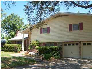CDPE Short Sale opportunity- BANK APPROVED THIS PRICE! spacious tri-level home located on a wonderful corner lot with mature landscaping in a quite neighborhood, just minutes from shopping, great schools and walking distance to a family friendly park. Three large bedrooms with plenty of closet space are located upstairs along with 2 bathrooms and a bonus storage loft. Entertaining is easy with the large kitchen, formal dining room and a comfortable living room with a beautiful fireplace on the main floor. A family room is located on the lower level; you will also find the utility room, a half bath and a work room on this level as well as access to the 2 car garage. A 13X 17 screen room can be found just off the kitchen; as well as the fenced back yard. Original owner was a developer