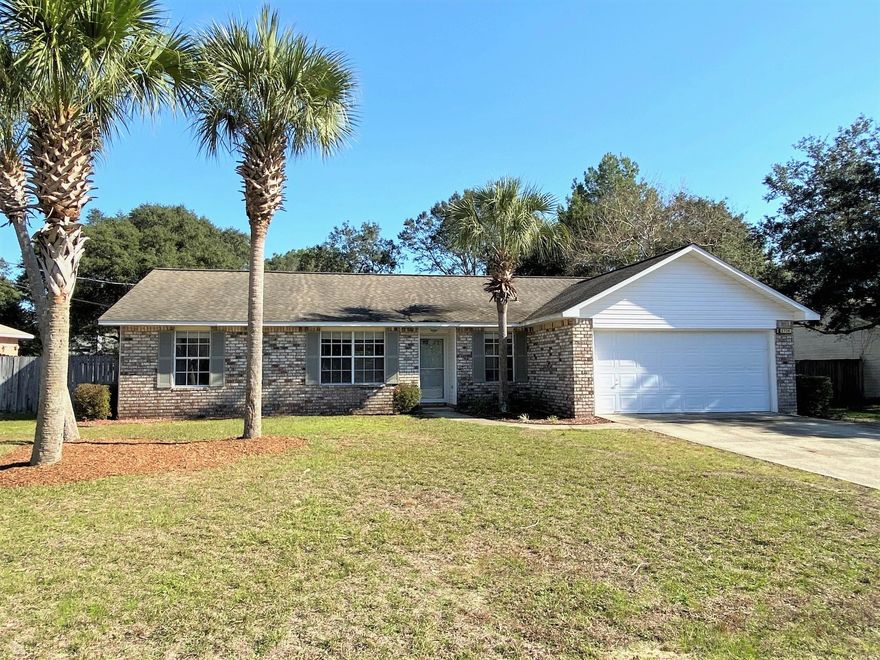 Welcome Home! This beauty is located on a quiet street with a cul-de-sac at one end and a view of the bayou at the other end. You'll even be able to catch glimpses of beautiful Florida sunsets from your front yard! Boasting 3 bedrooms, 2 bathrooms, and 1504 square feet of living space, the open floor plan makes this the perfect family home. The great room features vaulted ceilings, built in plant shelving, tile flooring, and abundant natural light. The kitchen features stainless steel refrigerator, eat-in dining space, and pantry. The two guest bedrooms each have large closets and share a well-appointed guest bathroom. The spacious master bedroom and bathroom suite allow for a private retreat, and feature walk-in closet, dual sink vanity, and garden tub. You will enjoy mornings and evenings on your screened back porch overlooking the spacious privacy fenced backyard that showcases a mature lemon tree. 

Other features of this beautiful home include laundry room, split bedroom floor plan, new carpet in the bedrooms, new luxury vinyl plank flooring in the bathrooms, fresh paint throughout, and low maintenance landscaping.  Additionally, this well-maintained neighborhood does not have an HOA.

Ideally located, this home is just 4 miles to Navarre Beach so you can be at the beach in just minutes, and less than 20 minutes from Hurlburt Field to the east, and 30 minutes from Pensacola to the west.  Hurry and schedule your showing today!