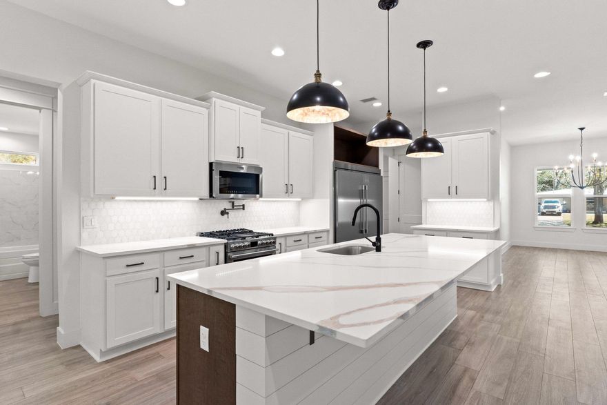 Stunning New Construction in Highly Sought-After Elliot Point neighborhood!  Experience luxury living in this breathtaking 4-bedroom, 3.5-bathroom all brick home, nestled in the prestigious neighborhood of Elliot Point. Designed with elegance and functionality in mind, this home features a sophisticated formal dining room and a spacious great room with soaring 10' ceilings,  creating an open and airy atmosphere. The 9' ceilings in the bedrooms add to the home's expansive feel.The gourmet kitchen is a chef's dream, boasting an oversized island, 30'' gas range, larger pantry, and a full-size fridge and freezer providing ample storage for all your culinary needs. Beautiful granite countertops add to the high-end finishes, while a tankless water heater ensure efficiency and comfort! Enjoy outdoor living at its finest with an oversized covered back  porch & large yard  perfect for entertaining. The privacy fence offers seclusion, while hurricane impact-rated windows and doors provide peace of mind.

Don't miss this rare opportunity to own a stunning new home in Elliot Point! 

