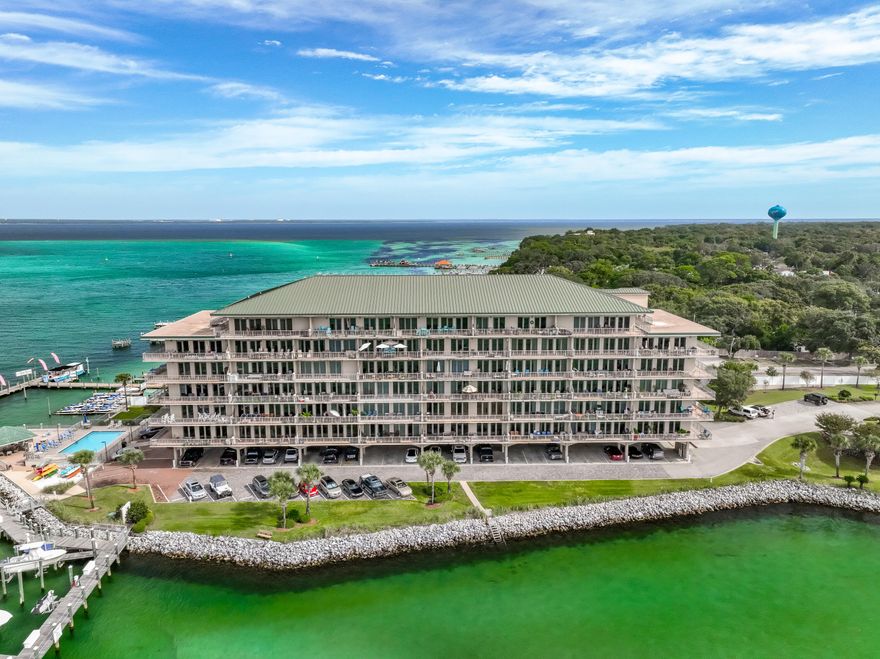 Perched on the shimmering bay in Destin, this stunning three-bedroom condominium offers an idyllic blend of luxury, comfort, and natural beauty. From its elevated vantage, the home captures sweeping views of the emerald waters that stretch out to the horizon, the sun dancing across it in changing hues by day, and reflecting soft pastels at dusk A beautiful, private balcony connected to the master bedroom -- a place to sip coffee in the morning and watch sunset hues reflecting off emerald water. Comfortably sized living room that opens up toward the balcony, designed so that the incredible view becomes part of your everyday space. This condo is being offered with most furnishings.
Please inquire for a list of furniture and items that will convey with an acceptable offer.
