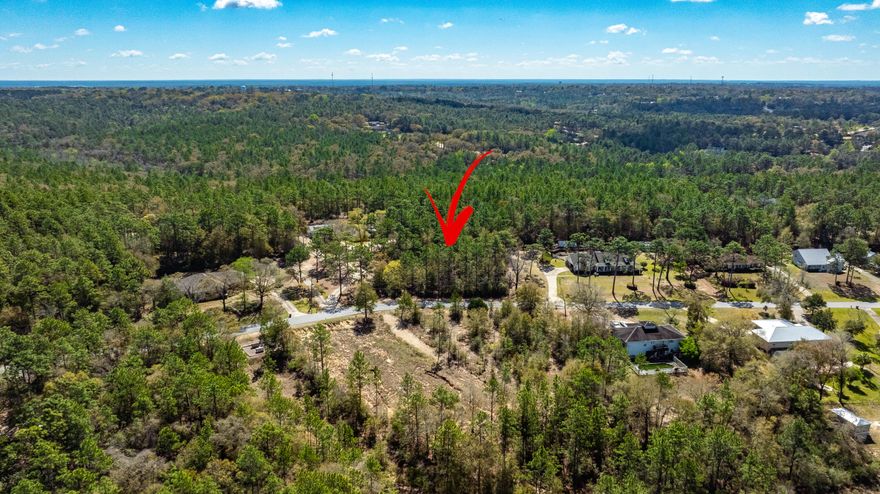 Vacant land with a lot of privacy.  Tucked away on a quiet street yet close to shops, restaurants, and schools, with the beach just 40 minutes away. A wonderful place to build your custom home!
