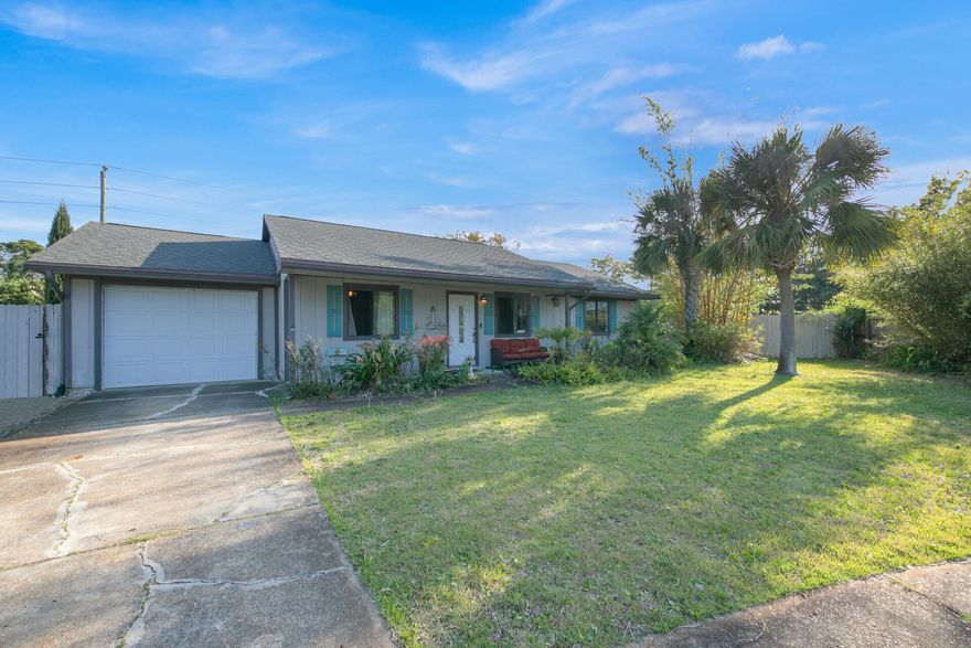 RELAX & UNWIND POOLSIDE FROM YOUR PRIVATE, GIANT .55 ACRE OASIS W/GUNITE POOL & SEPARATE 200 SF WORKSHOP W/POWER.  Sitting amongst lemon, tangerine, kumquat, banana, fig & olive trees, feel your stress melt away. Easily entertain family & friends poolside from your outdoor kitchen area w/grill, Green Egg & refrigerator.  Two year old Industrial Epoxy flooring & newer kitchen wi/granite counters take center stage.  Offering an open floor plan w/living area & separate 300 SF sun/FL rm, there's plenty of space. Other features include spacious master w/split floor plan,  laundry area, hurricane shutters, 7 Yr roof & NO HOA..The giant, fully fenced backyard provides privacy & a park like setting.  Two driveways, each with large gates allow easy access/storage of vehicles, RV or