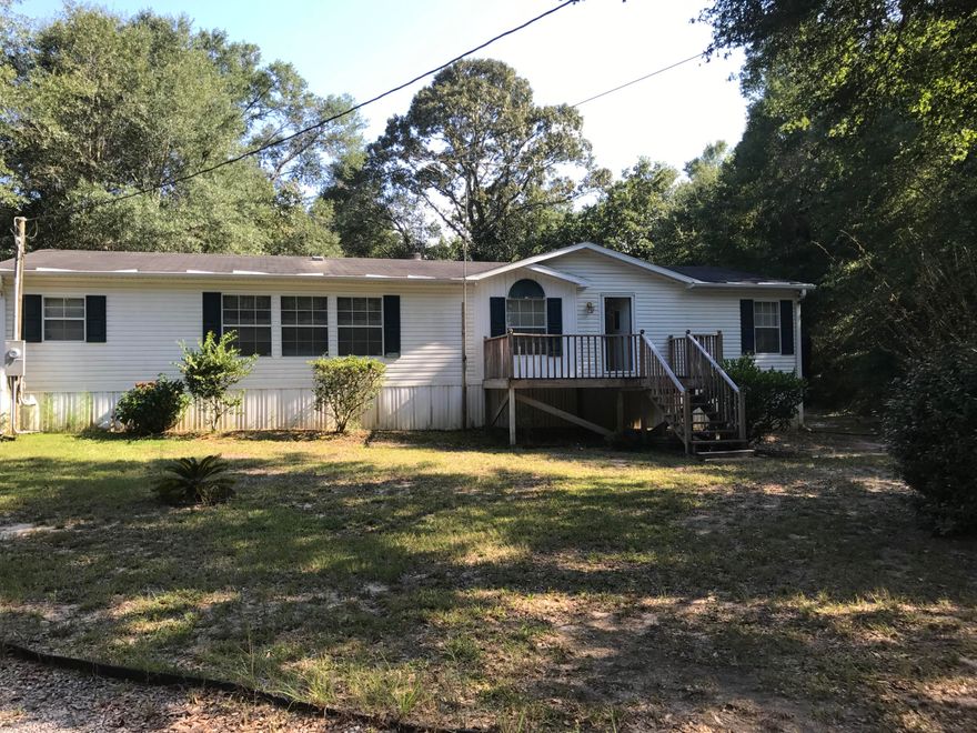 This is a well maintained manufactured home set up on permanent foundation with lots of area to move around. If you want peace and quiet this is your place. Jacuzzi tub off the back deck and a large yard to play in. Very secluded and serene .Seller is motivated so bring all offers.
