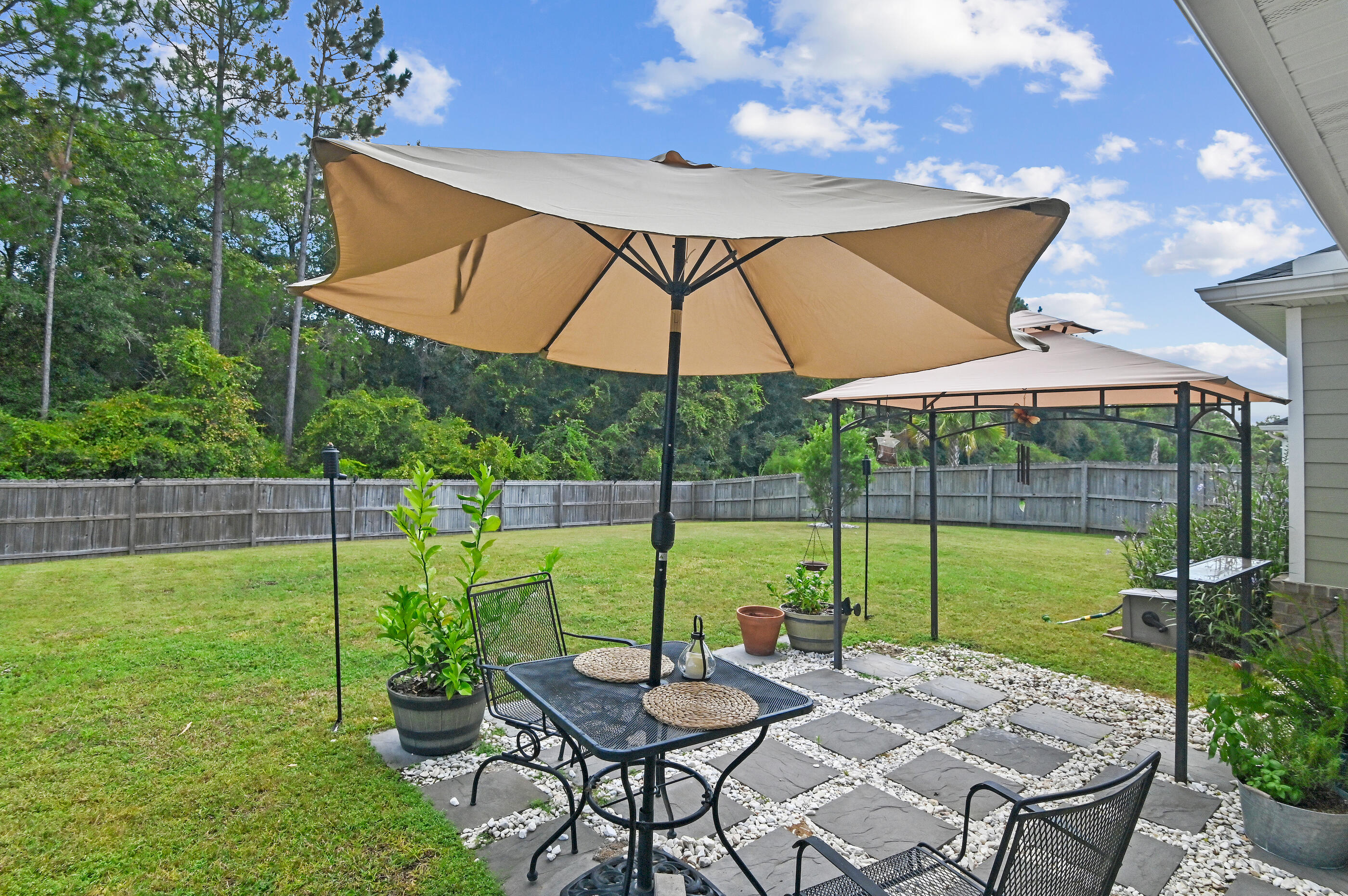 Hidden Oasis This immaculate 3BR/2BA Halifax home, built in 2018, feels brand new and has been meticulously maintained. Nestled on a private .28-acre fenced lot, it offers one of the largest and most unique backyards in Freeport; a true retreat for outdoor living. Inside, the open split floor plan flows seamlessly into the upgraded kitchen, pantry, with granite countertops, while the family room impresses with a tray ceiling and crown molding. The large master suite provides a peaceful escape with his & her closets and a tub and walk-in tile shower. Luxury vinyl plank flooring runs throughout, and a covered rear porch expands your living space outdoors. Conveniently located near schools, shopping. Walk to the Community pool and playground.
