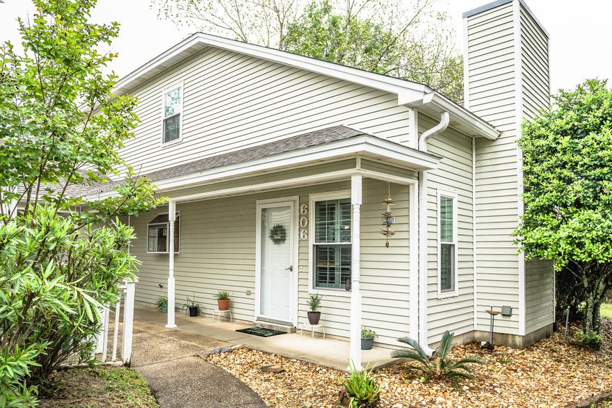 You can stop looking!  Beautiful and meticulously maintained townhome close to everything.  Spacious living area with vaulted ceilings, gorgeous stone fireplace, and plantation shutters.  Plenty of room to entertain.  Kitchen includes garden window over sink and large dining area.  Large downstairs bedroom with private access to full bath.  Massive master bedroom with window bench, space for in-room office, and walk-in closet.  Jacuzzi tub, separate shower, and extended vanity in master bath.  Quiet private patio.  New windows, covered and guest parking, and separate enclosed storage room.  Take a dip in the quiet neighborhood pool and part your boat in the on-site storage!  Close to shopping, both bases, schools, restaurants, and more.  Come and see, this won't last long!