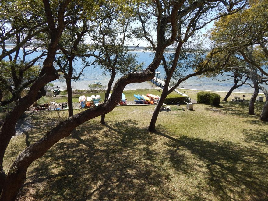 TRUE WATERFRONT & MOVE-IN-READY! Located on the CORNER/TOP FLOOR with only two neighboring condos (one beside and one below.) 2 Large Bedrooms & lots of closet space! Large Living/Dining room and a Great Kitchen with Pantry! The Bath is clean and fresh. Range/ Refrigerator/Dishwasher & Disposal all New in 2016! Conveniently located close to the POOL & Elevator. Beautiful Grounds located on the Intercoastal Waterway! Lovely Courtyard! This is a Great investment property! Many owners live here too! There is a Fabulous Community Room and Large Laundry Facility! Association dues pd monthly include: water/sewer/pest/yard maint/pool, roof, siding and ground keeping. No Pets allowed, so no worries about barking dogs. 6 Mth rental min so no Spring Breakers! Peaceful, Easy TRUE WATERFRONT Living