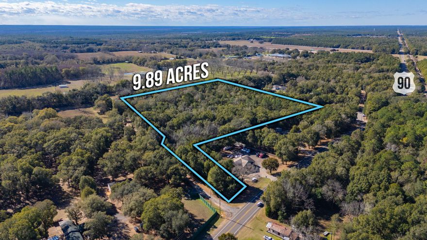 MIXED USE ZONING!! Acreage located in the heart of the Holt community w/ access directly off of Hwy 90. Property is being sold AS IS...there are currently two buildings on it. Power and water are believed to exist on the property since there is an old home site. Buyer to verify and satisfy themselves as to the existence of utilities and any other factors deemed important.