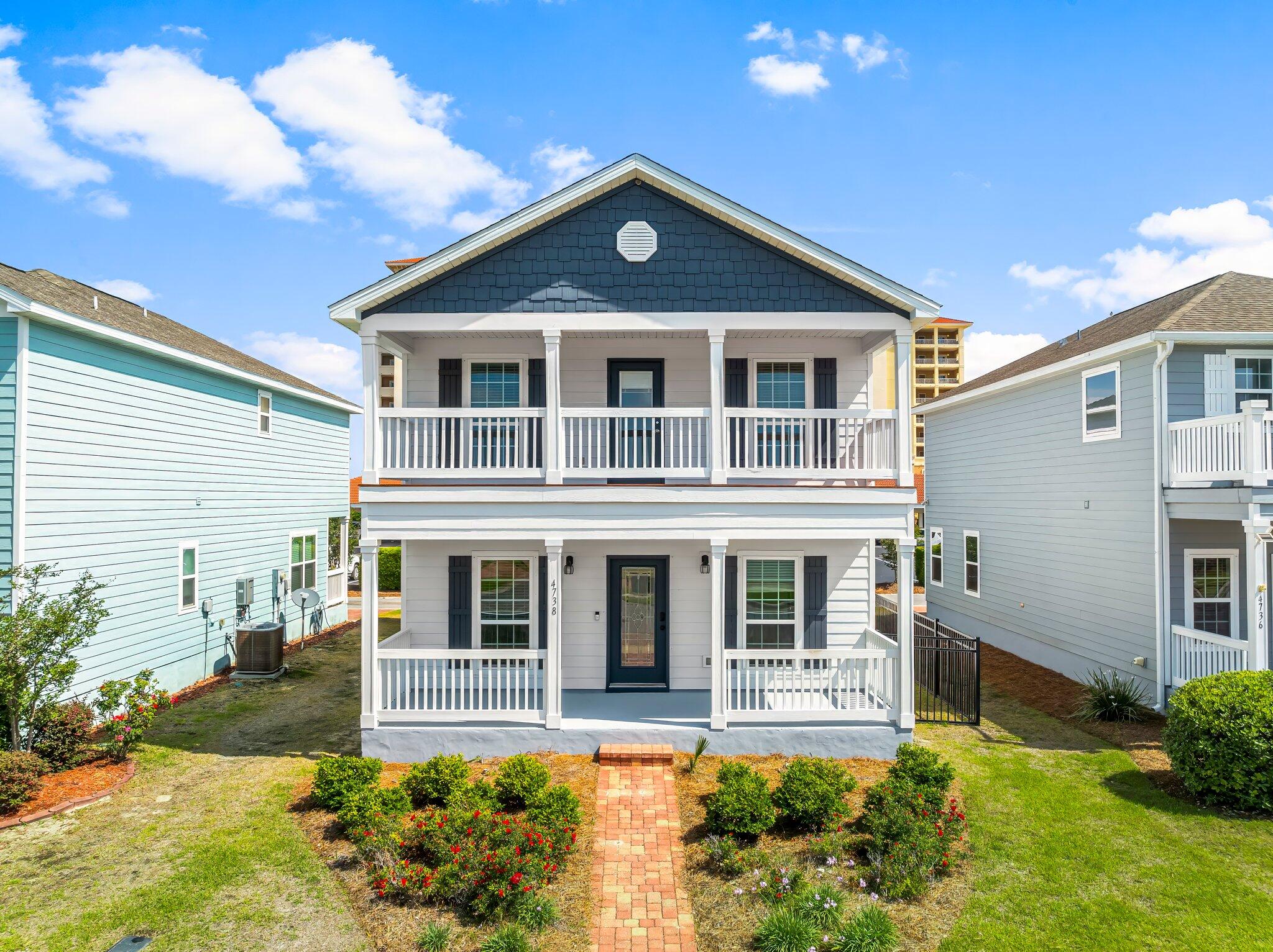 Beautiful two stores house in one of the most sought after areas of Panama City Beach, it is located in a neighborhood with a security gate , 3 bedrooms upstairs for privacy, and two full bathroom, a half bathroom on the first floor.Hardwood throughout the first floor, stairs case, and upstairs foyer. The kitchen offers a lot of cabinets and counter space, finished with granite and stainless-steel appliances. This house was entirely painted, had new water heate instaled in 2025, very nice landscaped yard with lawn maintenance included, plus irrigation and hurricane fabric shields, to mention a few. Magnolia Beach Club, a gated waterfront community with great amenities and features, come to check it for yourself.