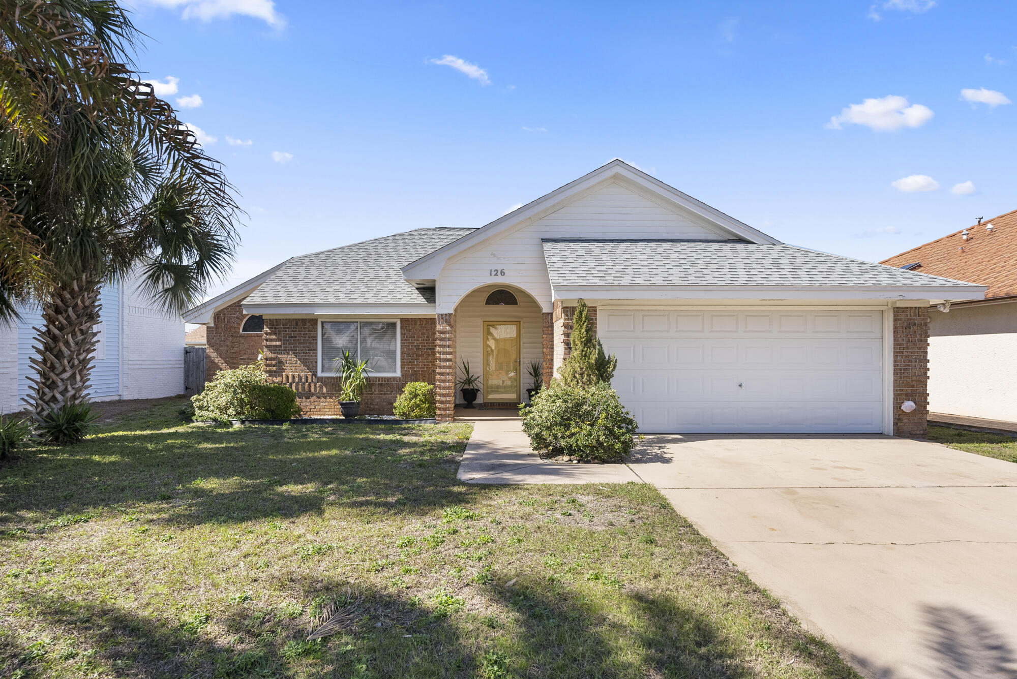 CURRENTLY UNDER CONTRACT -Welcome to 126 Seaclusion Drive!Located in the desirable Bid-A-Wee Beach neighborhood, this charming brick 2-bedroom home offers private, deeded beach access to over 2,500 feet of pristine shoreline--exclusive to residents and guests. No high-rises or public crowds, just a peaceful coastal retreat!Vaulted ceilings and natural light create an airy feel inside. The primary suite features a remodeled bath and private patio access. A spacious living area flows into the dining room and kitchen, with French doors leading to a newly built deck. A guest room, full bath, laundry room, and two-car garage complete the home.Minutes from Pier Park, top restaurants, and local attractions. Don't miss this incredible opportunity!