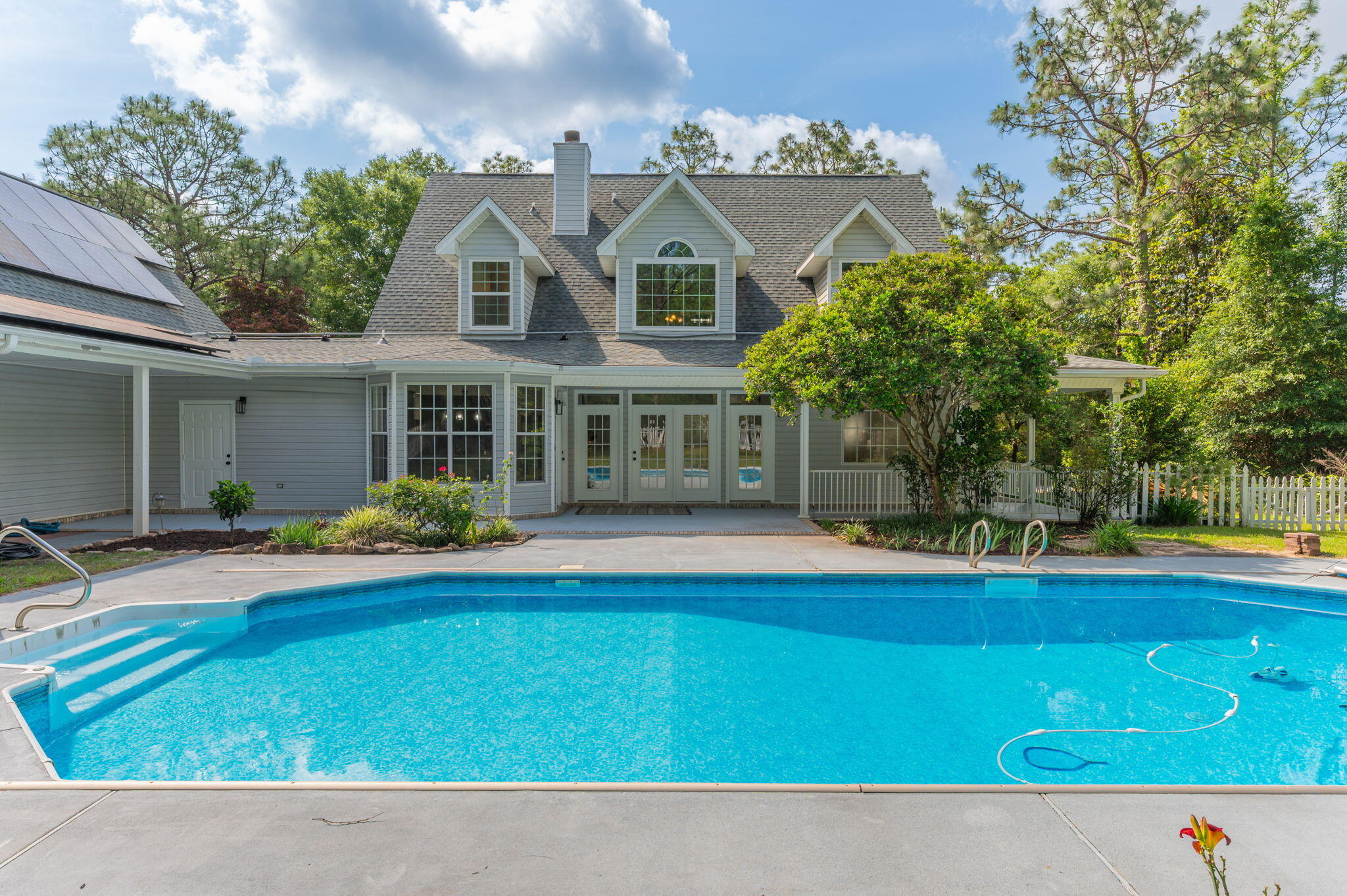 This beautifully, updated custom-built 2 story pool home boasts an expansive 4.83 acres lot in the heart of Crestview offering both privacy and ample space for outdoor activities. With 4 bedrooms and 4.5 bathrooms, This well maintained home combines luxury with comfort. As you enter, you'll be greeted by the elegance of professionally painted interiors that complement the flow of the new LVP flooring throughout the main living areas. The kitchen boasts brand-new appliances, quartz counter tops with plenty of counter space and storage. Master Bedroom is on the main floor. Upstairs bedrooms have brand new carpet.Brand new roof and paid off solar panels, loft style apartment opportunity over the 3rd garage with possible income opportunity