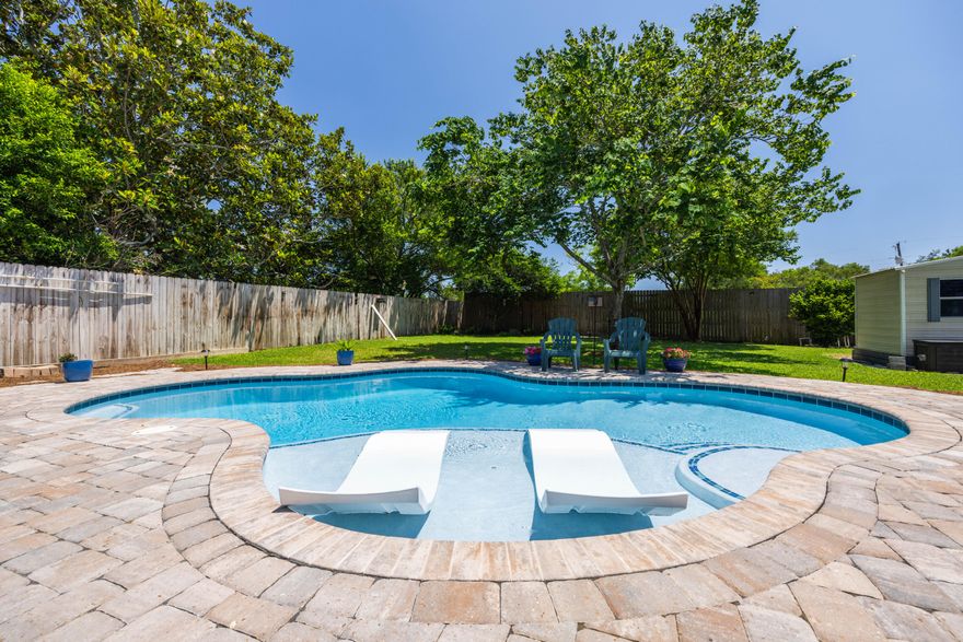 Welcome to your slice of paradise in Destin, Florida! Nestled on a generous .25-acre lot, this charming home offers the perfect blend of comfort and style. Step inside to discover a beautifully renovated interior featuring three bedrooms, two baths, and not one, but two spacious living areas, providing ample room for relaxation and entertainment.The heart of this home is its stunning custom salt water pool, complete with in-pool tanning ledge loungers and LED lights, creating a resort-like oasis right in your backyard. Imagine spending sunny days lounging by the pool, soaking up the Florida sunshine, or enjoying evening swims under the stars.For those who love to entertain, the outdoor space is a dream come true. The pool area is accompanied by a custom-built composite deck,