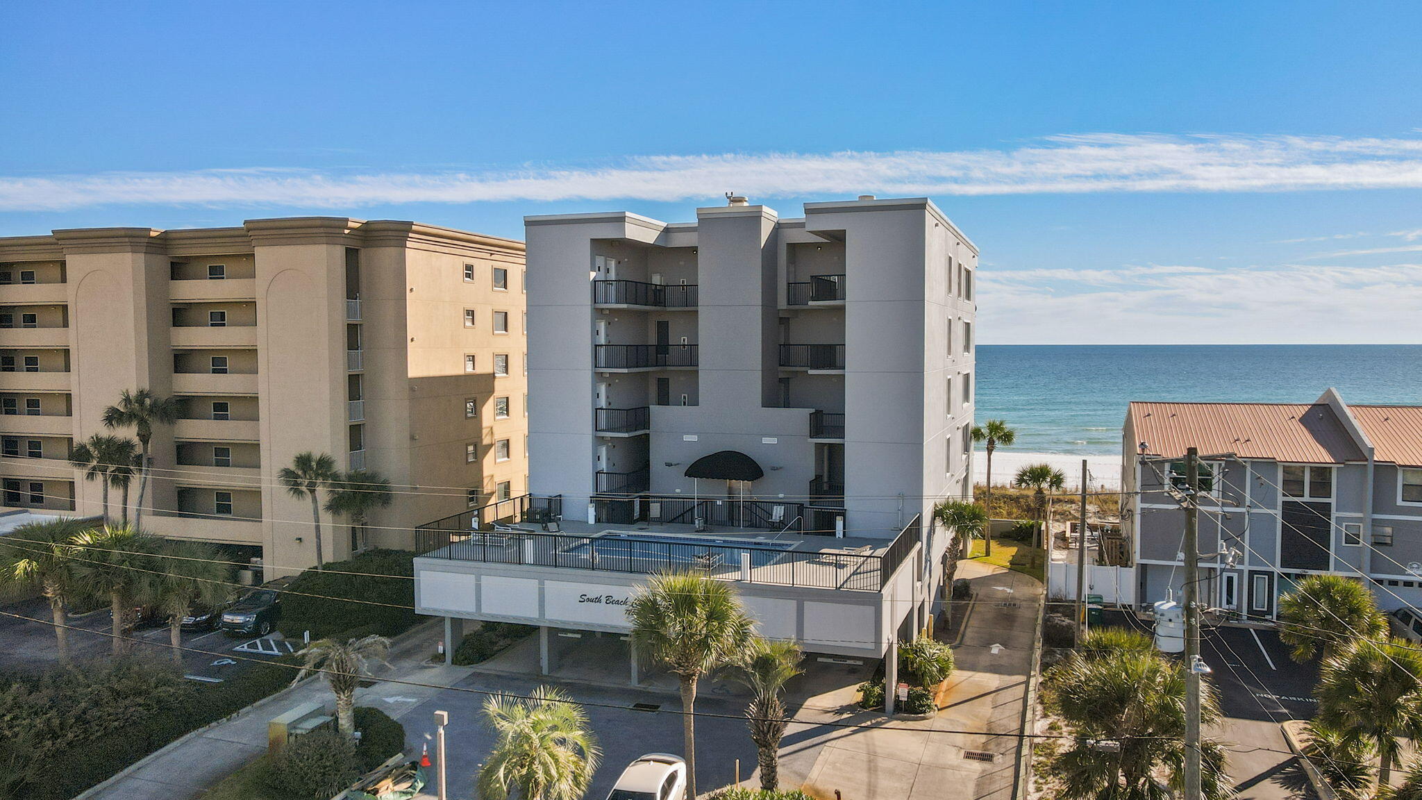 Beach front unit with beautiful gulf views. Quiet and peaceful with only 9 units in the complex. Private, beach access pier visible from inside or on the balcony where you can sit and watch family activities on the beach right in front of you. Mirrors across one wall section also reflects the beach view which is nice to look at from the kitchen area. The common area pool is heated during Spring Break. Each unit has an assigned covered parking space and storage unit in garage area for beach chairs, toys, etc. Recent upgrades include a new HVAC in 2022, the roof being replaced in 2020, in 2019 a new hot water heater, wood floors in the bedroom, stainless kitchen appliances and window treatments, new washer & dryer, replaced light fixtures, pantry shelves built in the laundry room and