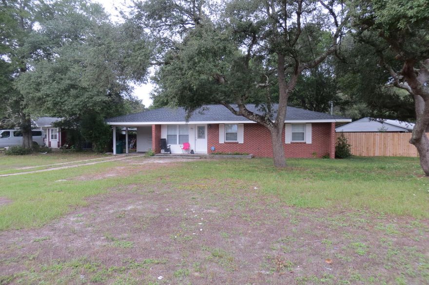 This home has been renovated inside and looks great. Large corner lot and minutes from both bases. Totally fenced in yard with a privacy fence. Inside was rewired and renovated 2 years ago. All new kitchen appliances, roof, HVAC system, tile floors in living areas and large laundry that has room for storage or hobby room. Did I mention it also had a new roof 2 years ago also and blown in insulation in the attic.... This home has alot to offer. Don't miss this home. It won't last long....